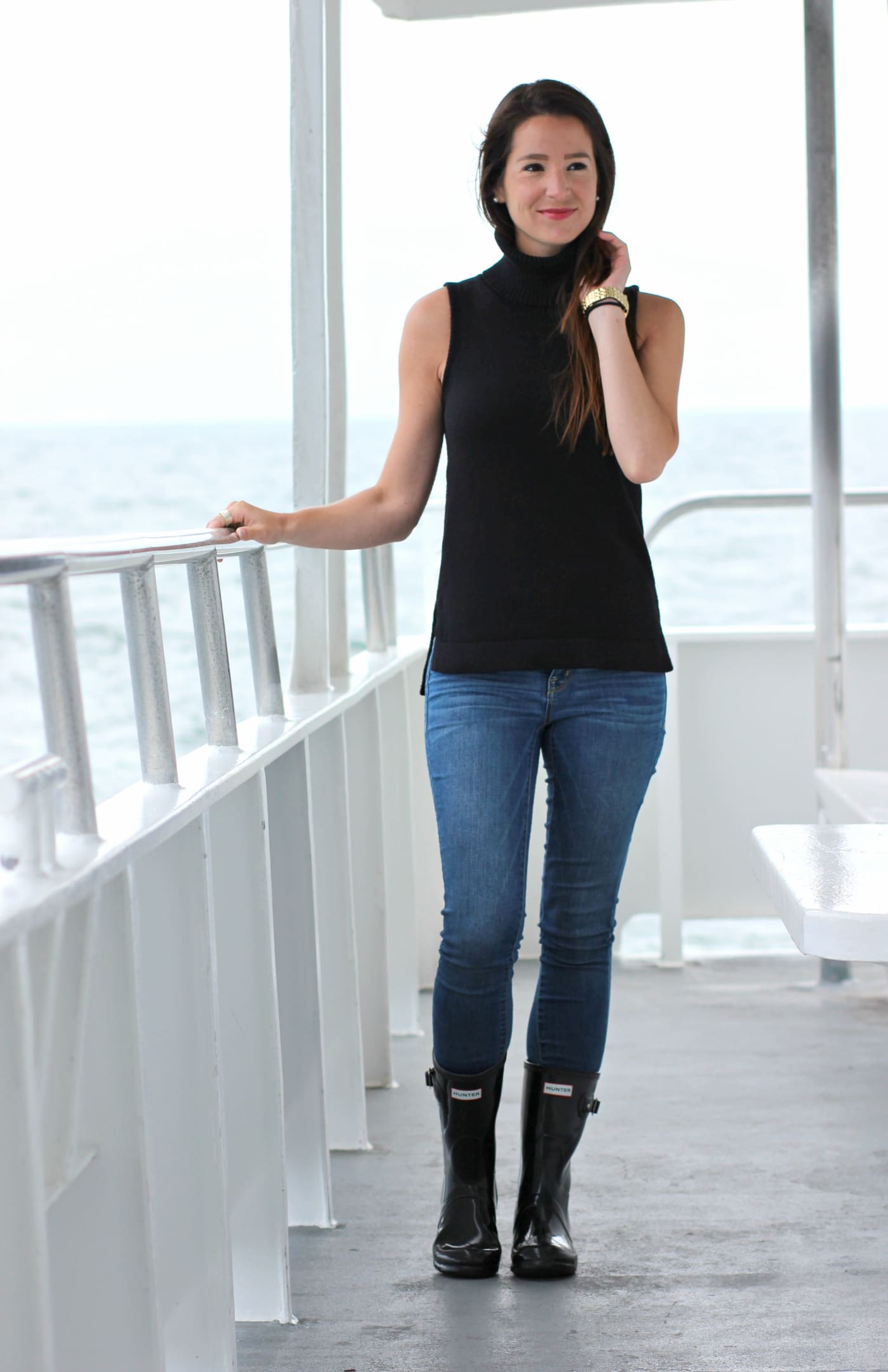 Whale watching in Maine with a J. Crew Factory sleeveless turtleneck, Hunter tain boots, and a handful of Zone Bars