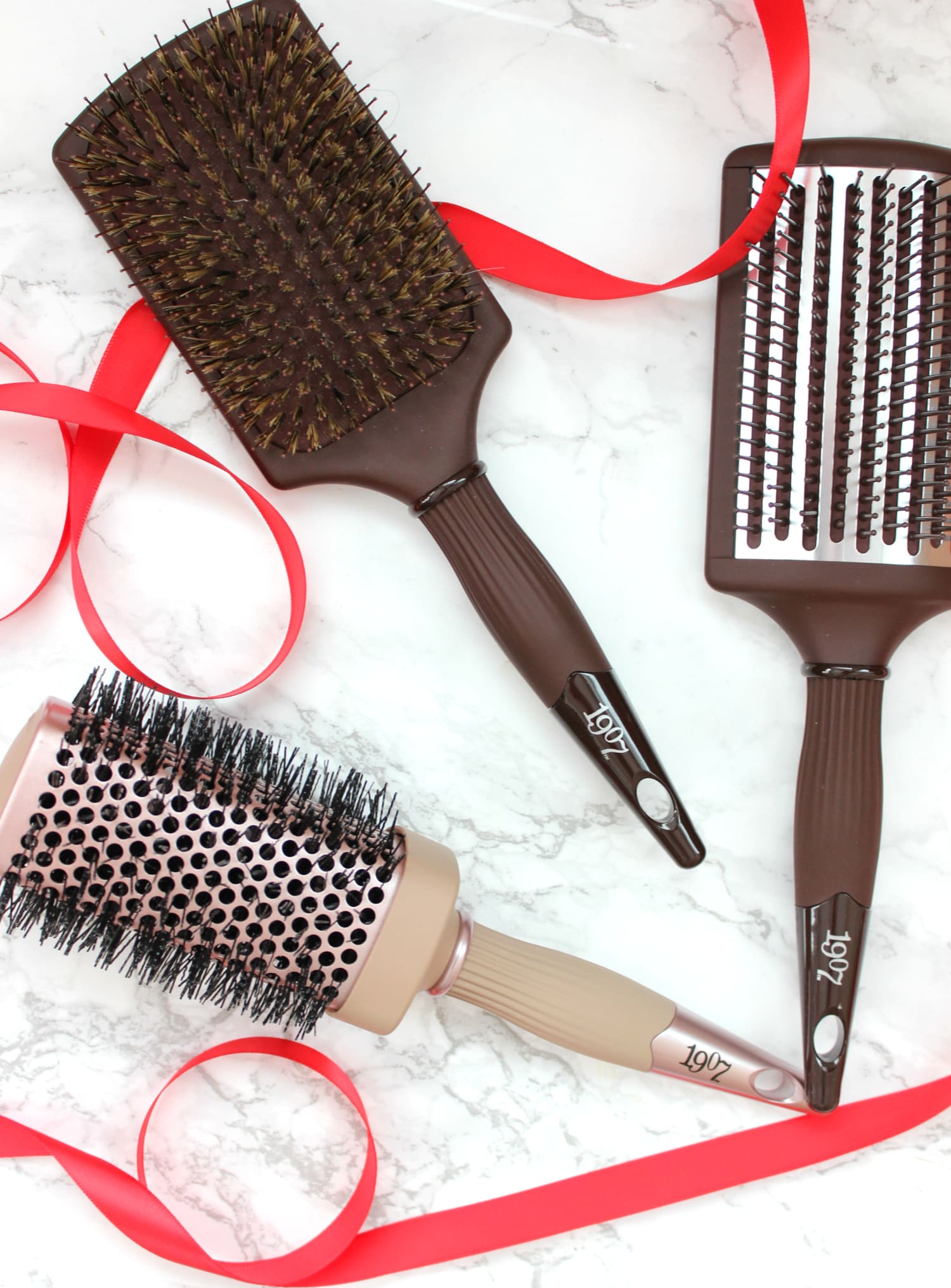 Easy sleek high sock bun tutorial with a 1907 by Fromm Glosser Paddle Brush