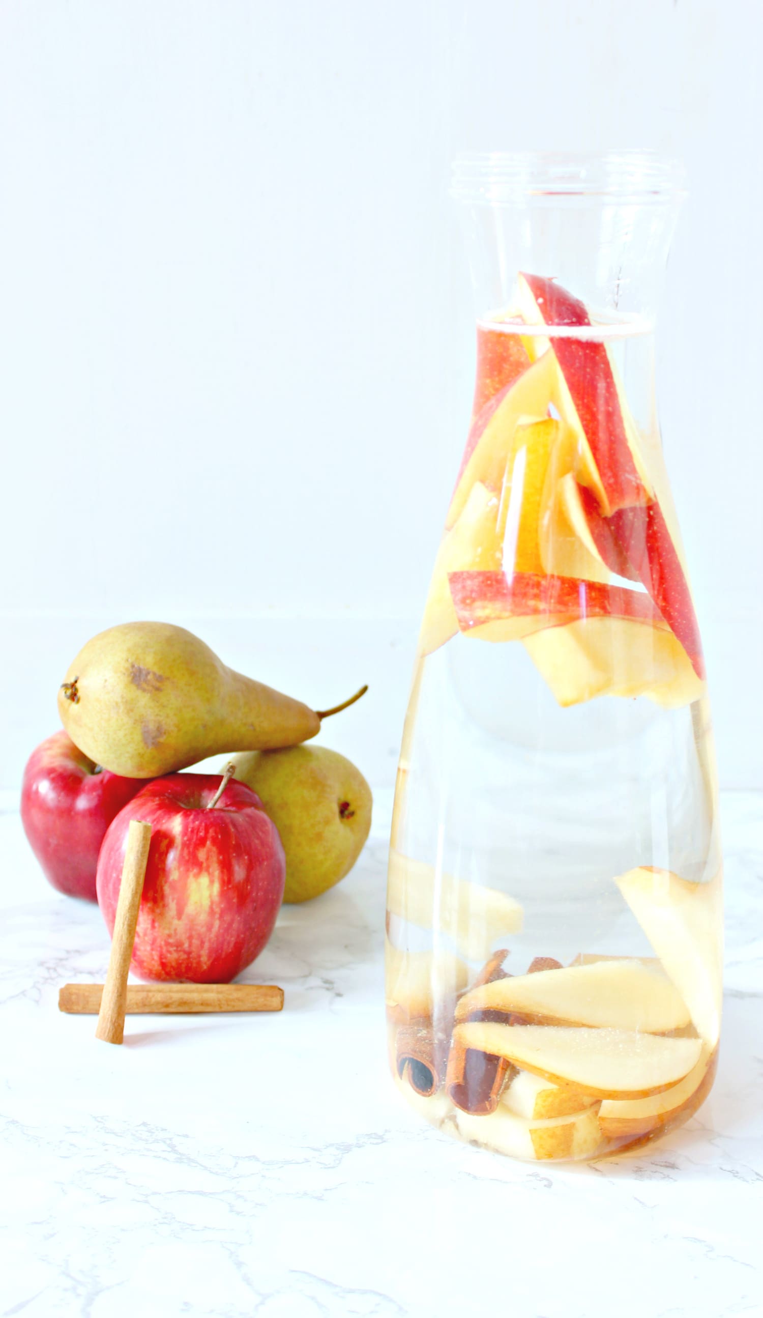 This cinnamon apple pear fall detox water is a must-try this holiday season for warding off stomach aches and holiday sugar highs!