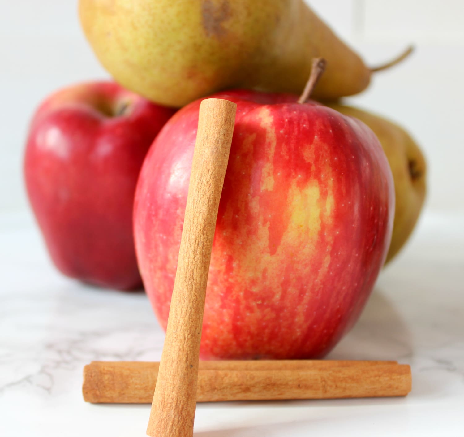This cinnamon apple pear fall detox water is a must-try this holiday season for warding off stomach aches and holiday sugar highs!
