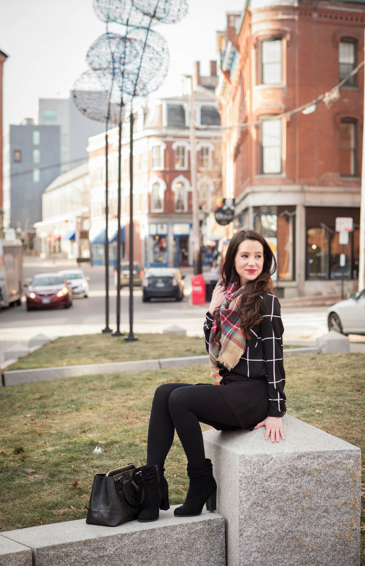 Chic all black winter outfit with a pop of color in the scarf