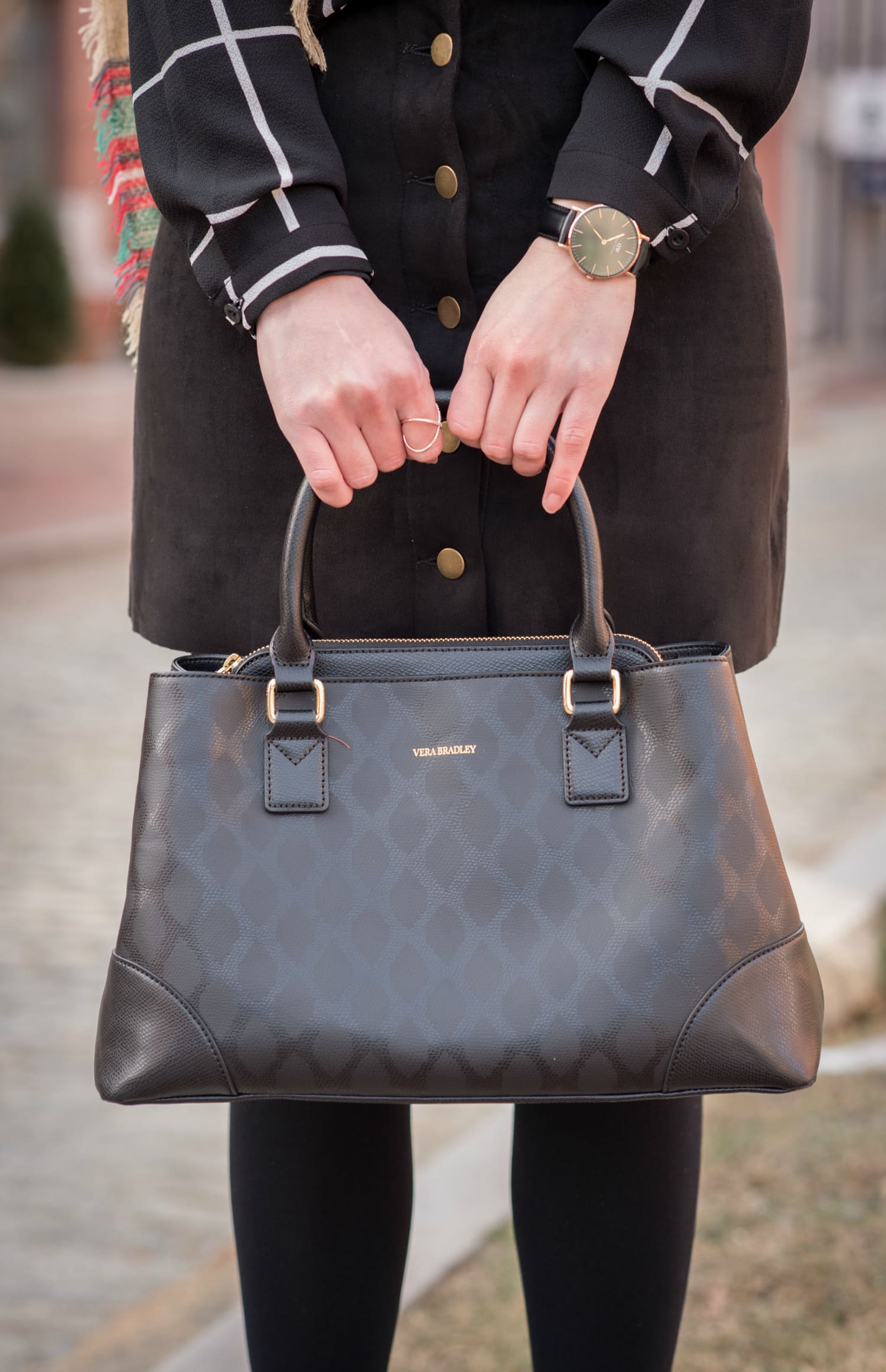 Chic all black winter outfit with a pop of color in the scarf