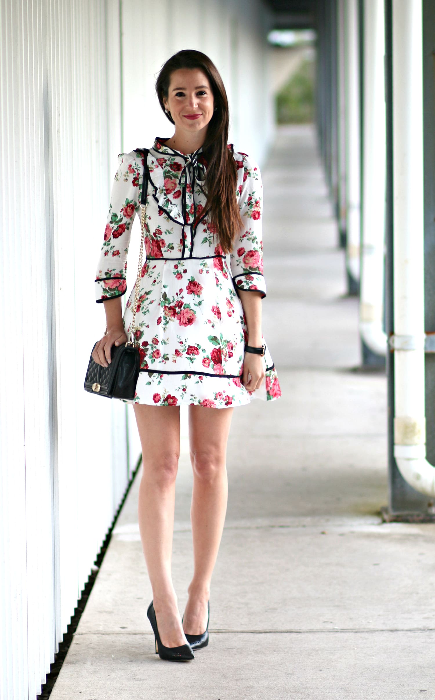 Belle inspired cocktail dress with floral rose print, chic neck tie detailing, and three quarter sleeves