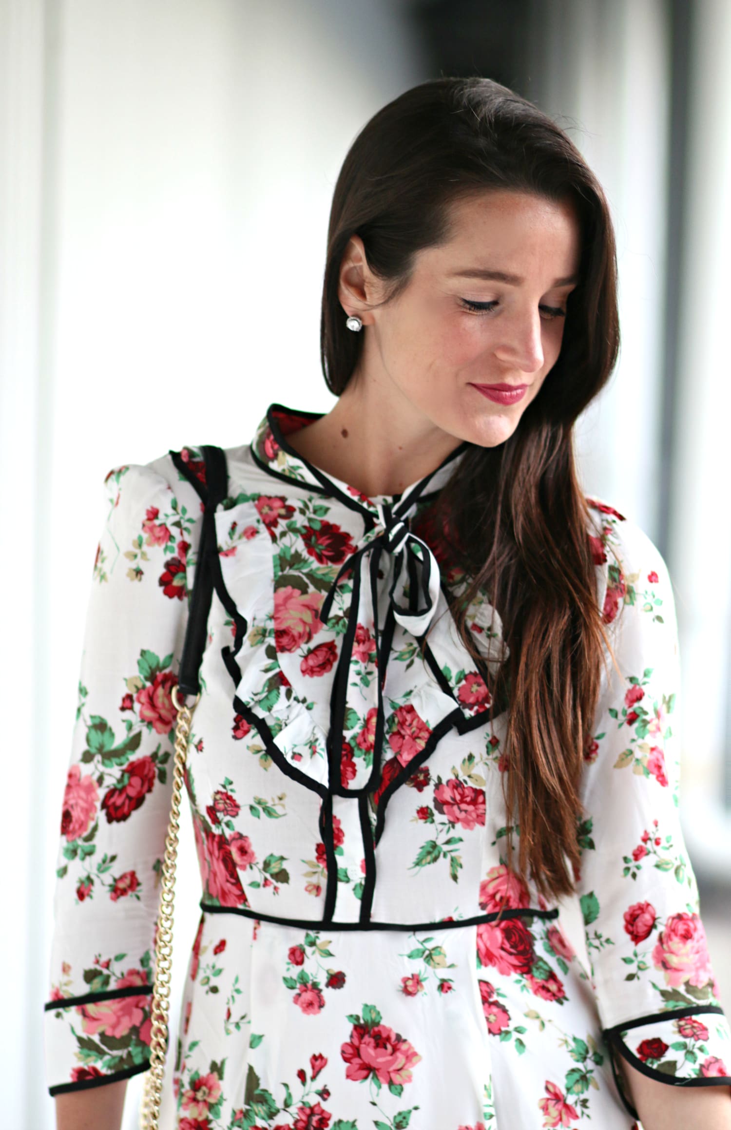 Belle inspired cocktail dress with floral rose print, chic neck tie detailing, and three quarter sleeves