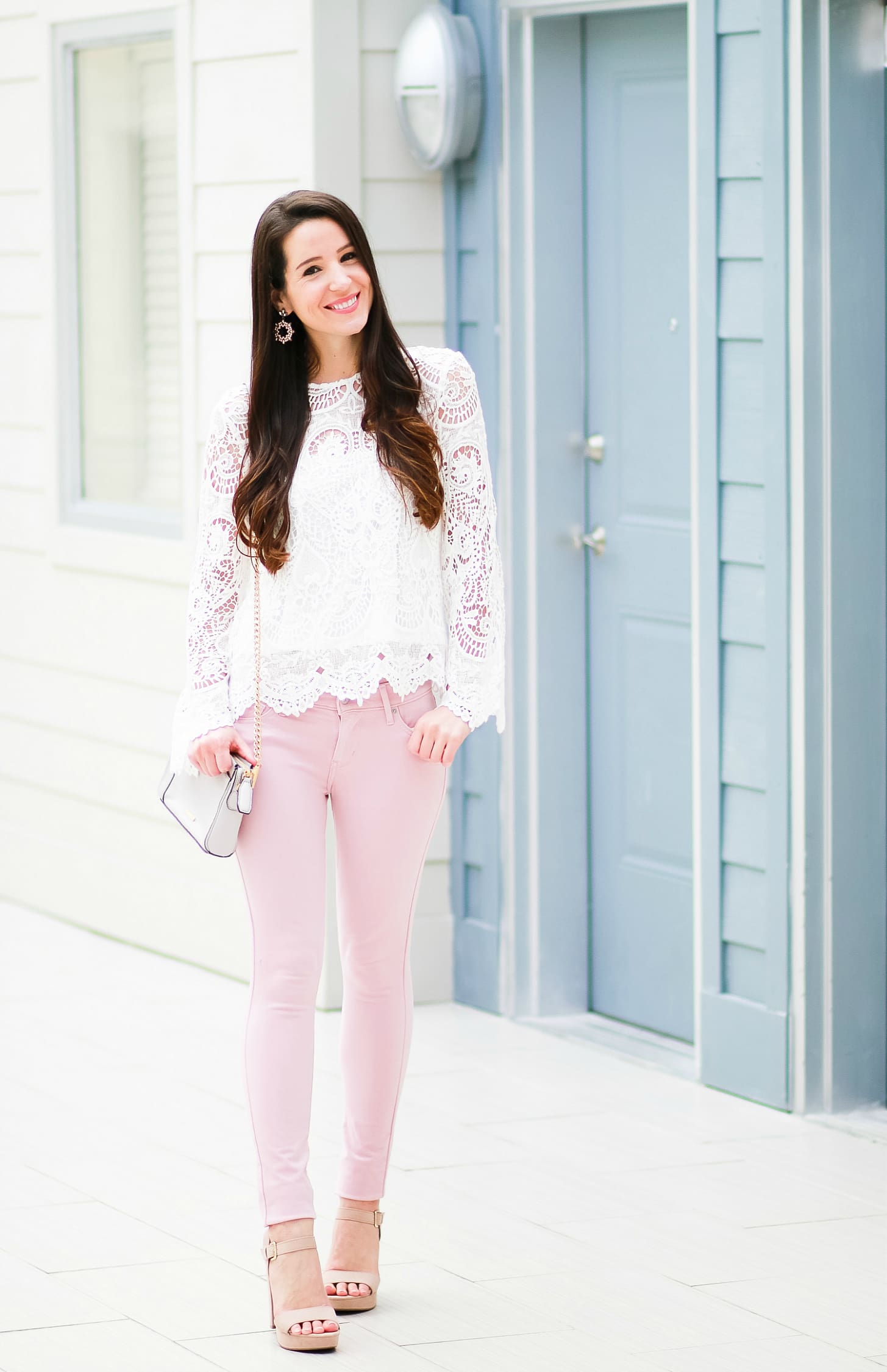 Levi pink skinny jeans with WAYF white lenox lace top, Rebecca Minkoff Avery crossbody bag, Sam Edelman tan block heel sandals, SUGARFIX by Baublebar embellished hoop earrings, and Kate Spade New York Mini Metro Leopard Watch | How to wear pink skinny jeans in the fall plus all the details on Shopbop's End-of-the-Season Sale by fashion blogger Stephanie Ziajka from Diary of a Debutante