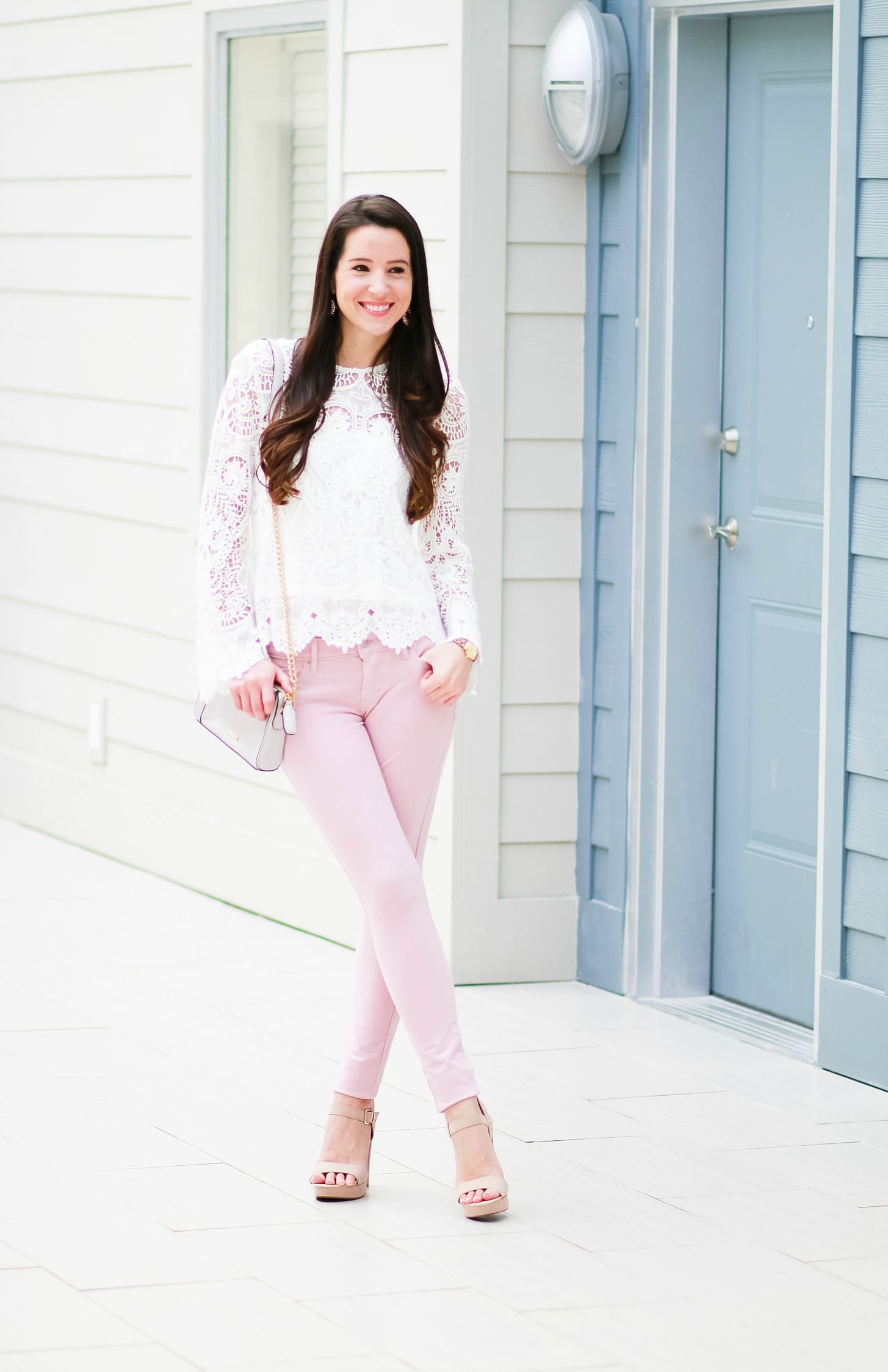 Levi pink skinny jeans with WAYF white lenox lace top, Rebecca Minkoff Avery crossbody bag, Sam Edelman tan block heel sandals, SUGARFIX by Baublebar embellished hoop earrings, and Kate Spade New York Mini Metro Leopard Watch | How to wear pink skinny jeans in the fall plus all the details on Shopbop's End-of-the-Season Sale by fashion blogger Stephanie Ziajka from Diary of a Debutante