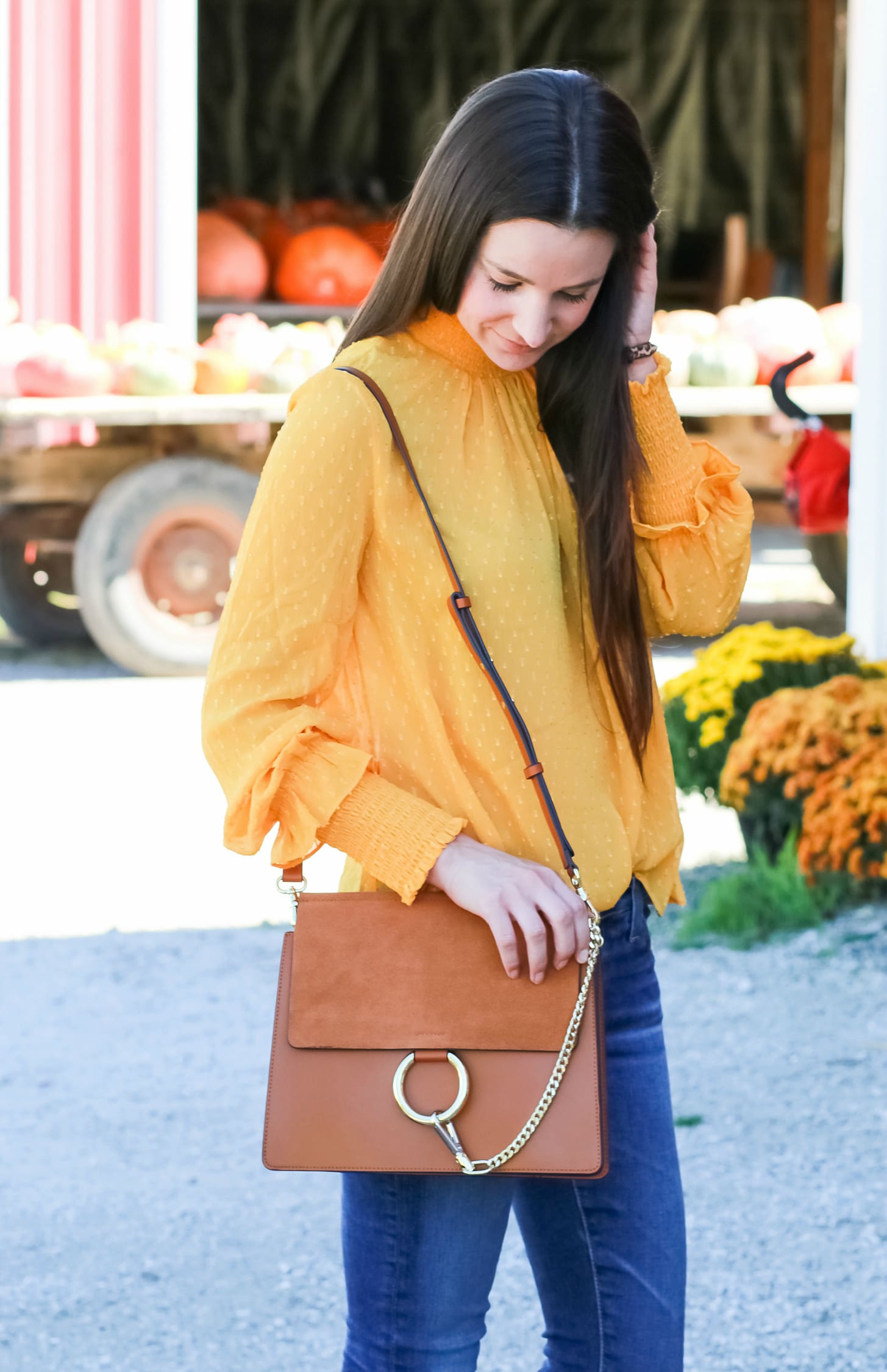 English Factory marigold swiss dot blouse with victorian collar, AG The Legging raw hem ankle skinny jeans, leopard flats, and brown Chloe Faye dupe bag | How to wear a victorian collar casually for fall by fashion blogger Stephanie Ziajka from Diary of a Debutante