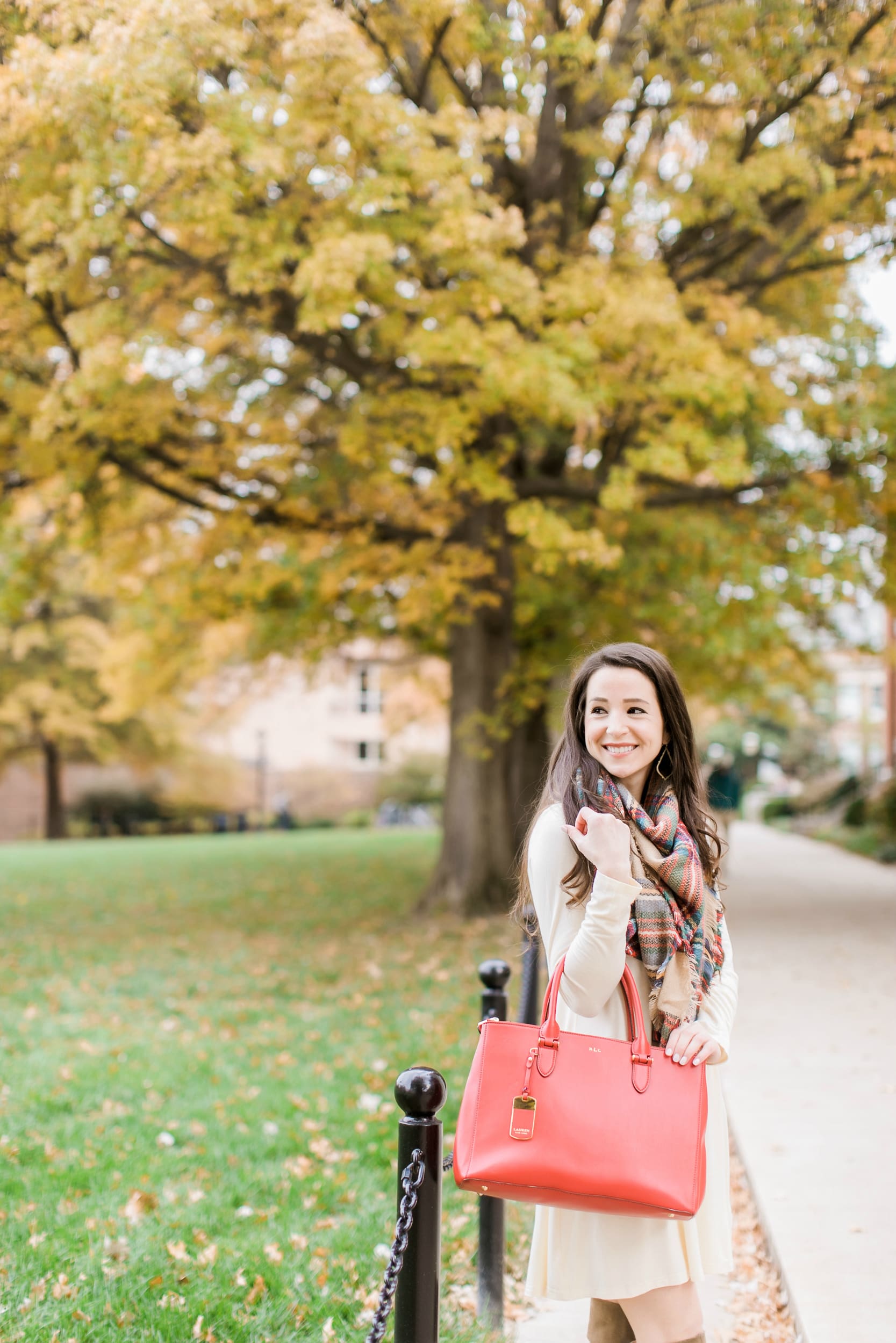 Beige cotton swing dress with tartan blanket scarf, Free People cognac OTK boots, red Ralph Lauren handbag, and Kendra Scott Sophee earrings | Casual holiday outfit idea | 10 tips for looking your best on camera | Tips for Looking Your Best in Holiday Photos from fashion blogger Stephanie Ziajka of Diary of a Debutante