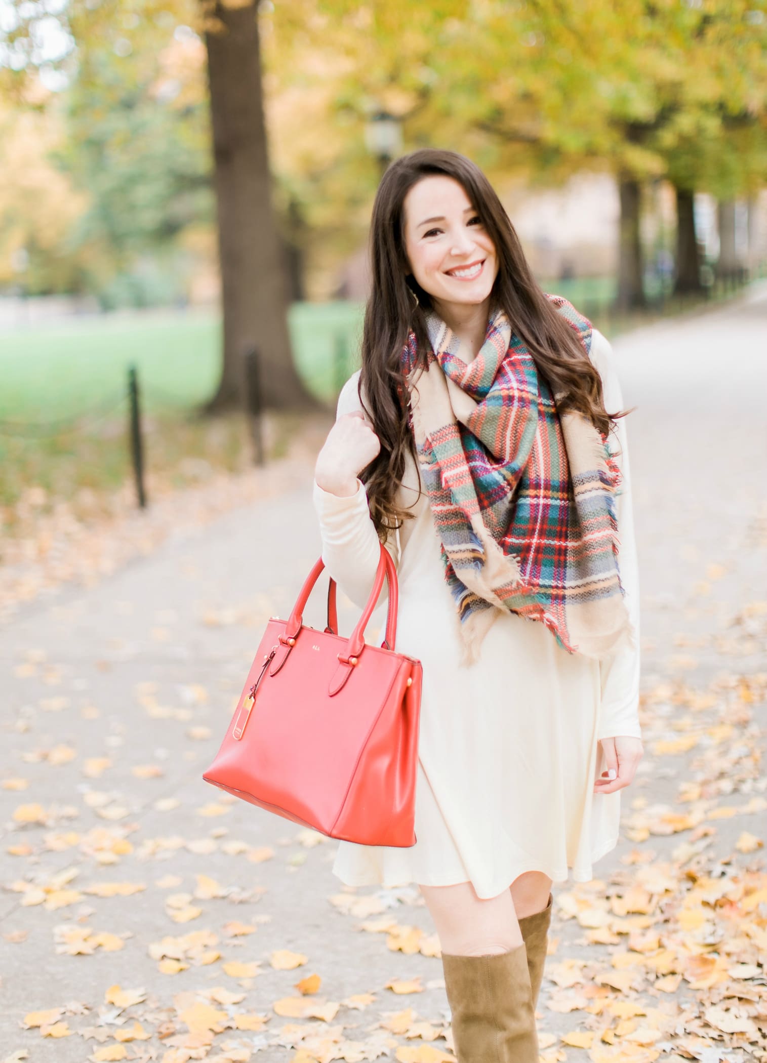 Beige cotton swing dress with tartan blanket scarf, Free People cognac OTK boots, red Ralph Lauren handbag, and Kendra Scott Sophee earrings | Casual holiday outfit idea | 10 tips for looking your best on camera | Tips for Looking Your Best in Holiday Photos from fashion blogger Stephanie Ziajka of Diary of a Debutante