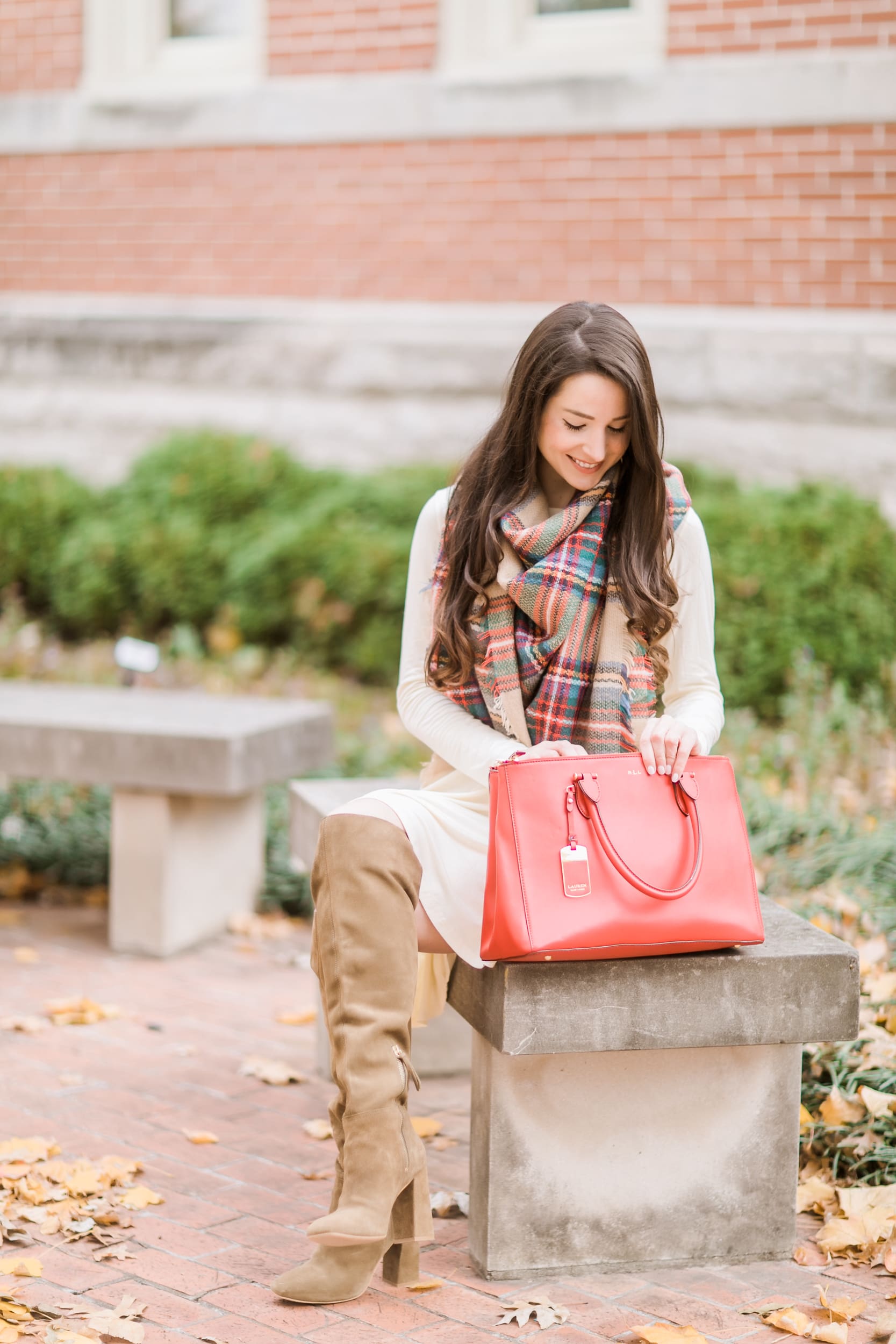 Beige cotton swing dress with tartan blanket scarf, Free People cognac OTK boots, red Ralph Lauren handbag, and Kendra Scott Sophee earrings | Casual holiday outfit idea | 10 tips for looking your best on camera | Tips for Looking Your Best in Holiday Photos from fashion blogger Stephanie Ziajka of Diary of a Debutante