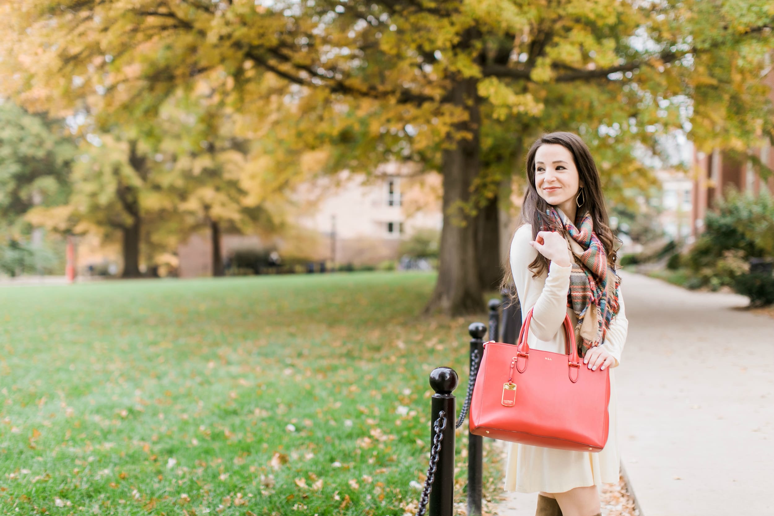Beige cotton swing dress with tartan blanket scarf, Free People cognac OTK boots, red Ralph Lauren handbag, and Kendra Scott Sophee earrings | Casual holiday outfit idea | 10 tips for looking your best on camera | Tips for Looking Your Best in Holiday Photos from fashion blogger Stephanie Ziajka of Diary of a Debutante