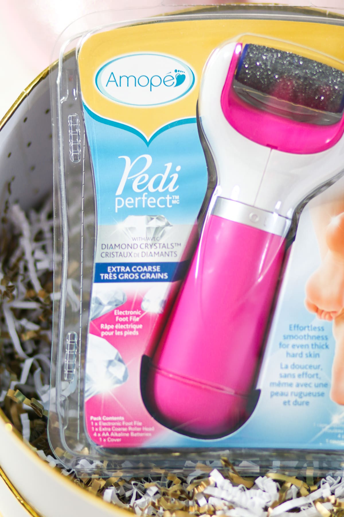 DIY spa gift basket consisting of 12 self care gift ideas she's guaranteed to love, including the Amope Pedi Perfect Foot File, by southern blogger Stephanie Ziajka from Diary of a Debutante