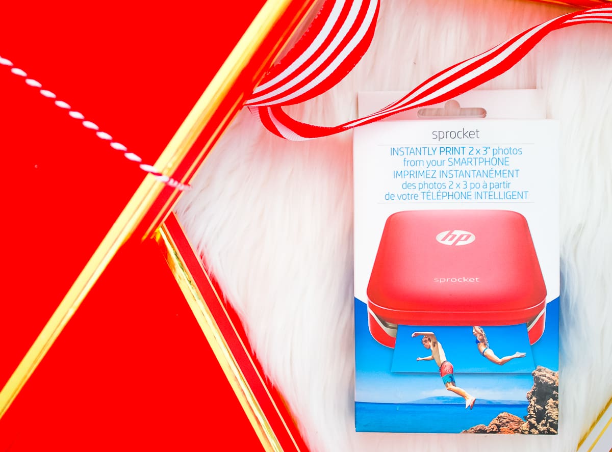 Red HP Sprocket Photo Printer, which makes a perfect stocking stuffer and is the best instant photo printer for events and travel by southern blogger Stephanie Ziajka from Diary of a Debutante