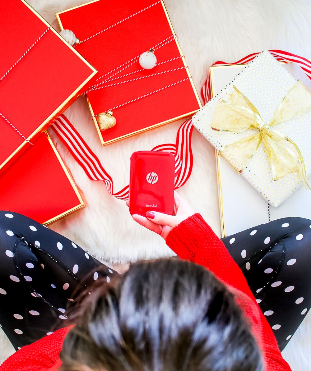 Red HP Sprocket Photo Printer, which makes a perfect stocking stuffer and is the best instant photo printer for events and travel by southern blogger Stephanie Ziajka from Diary of a Debutante