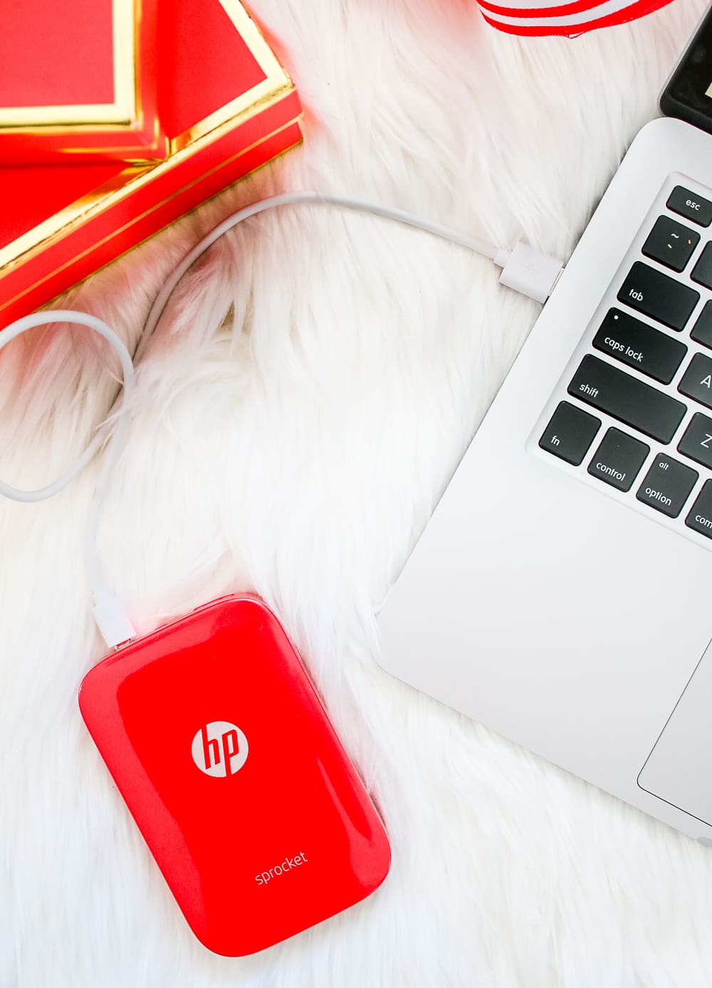Red HP Sprocket Photo Printer, which makes a perfect stocking stuffer and is the best instant photo printer for events and travel by southern blogger Stephanie Ziajka from Diary of a Debutante