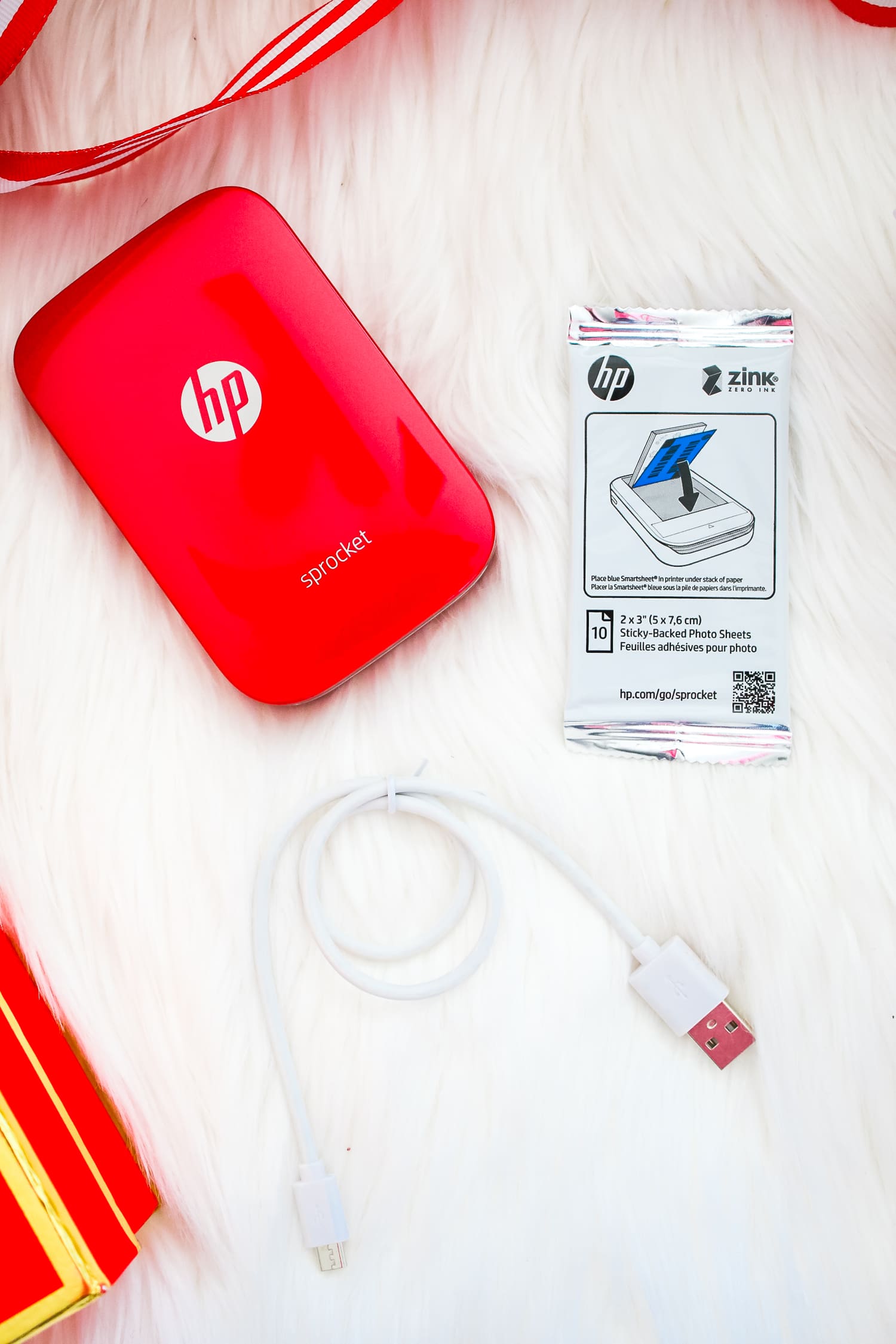 Red HP Sprocket Photo Printer, which makes a perfect stocking stuffer and is the best instant photo printer for events and travel by southern blogger Stephanie Ziajka from Diary of a Debutante