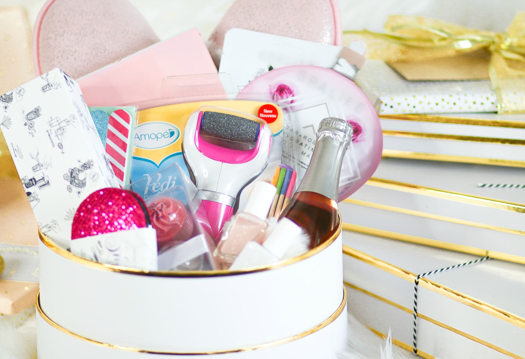 DIY spa gift basket consisting of 12 self care gift ideas she's guaranteed to love, including the Amope Pedi Perfect Foot File, by southern blogger Stephanie Ziajka from Diary of a Debutante