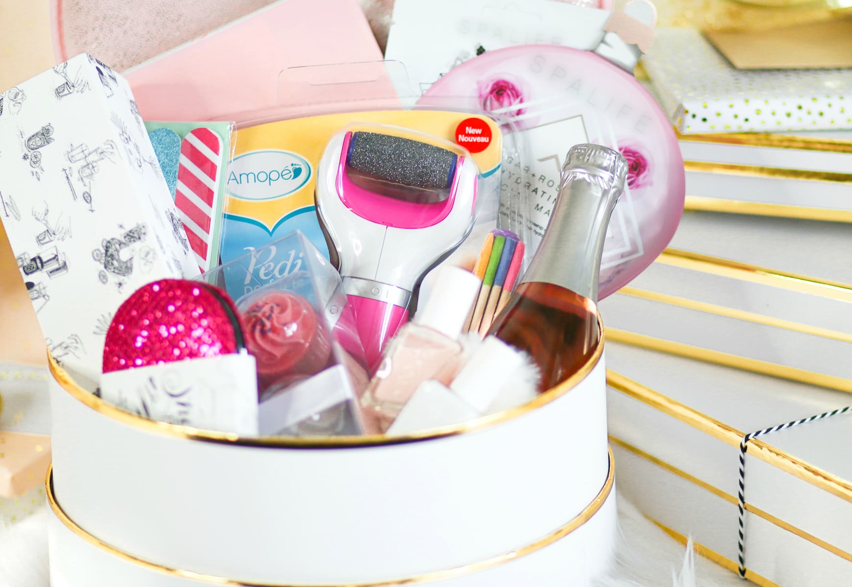 DIY spa gift basket consisting of 12 self care gift ideas she's guaranteed to love, including the Amope Pedi Perfect Foot File, by southern blogger Stephanie Ziajka from Diary of a Debutante