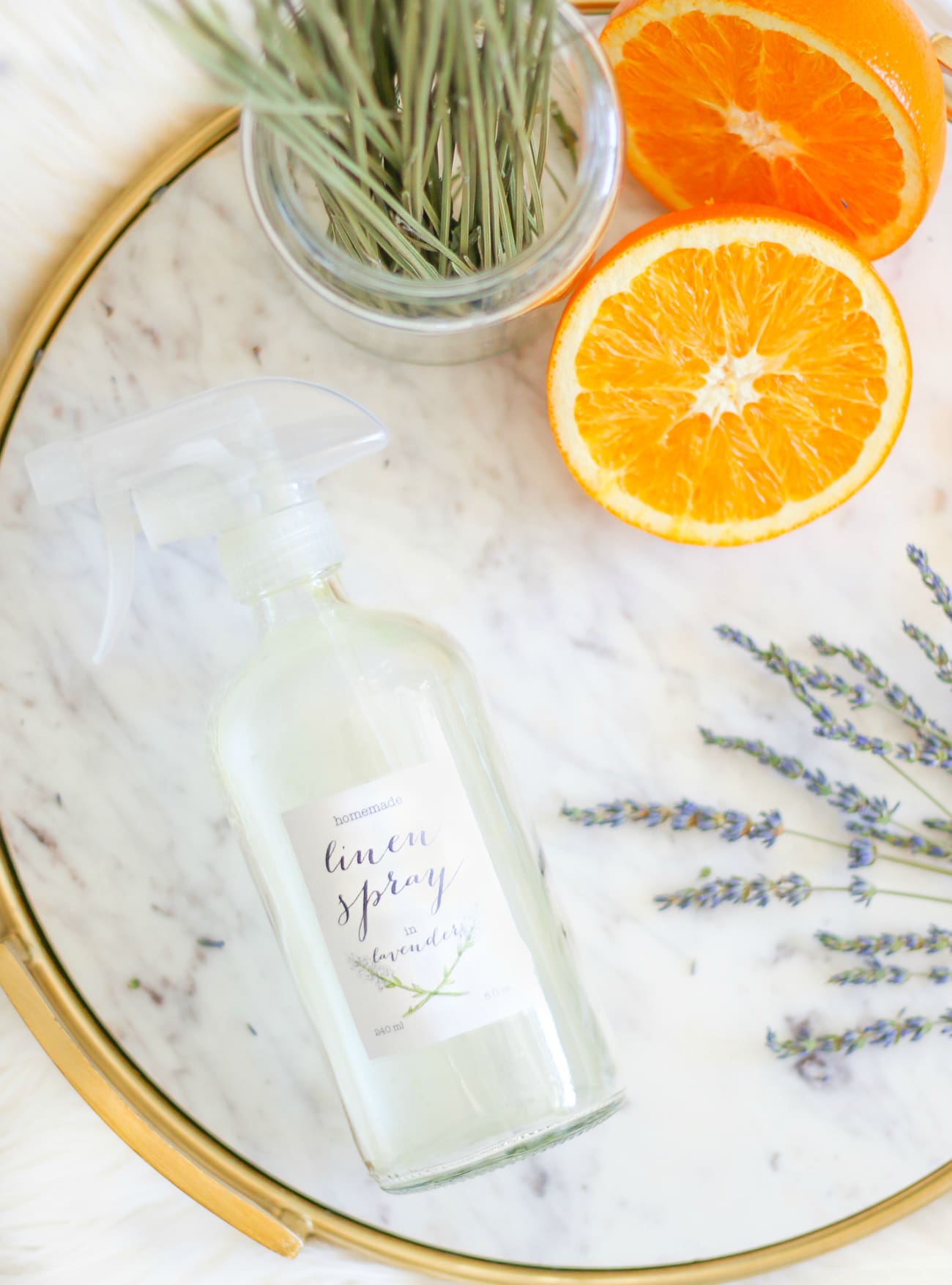 DIY essential oil linen spray by southern fashion blogger Stephanie Ziajka from Diary of a Debutante, DIY laundry spray with lavender, sweet orange, and tea tree oil from Thursday Plantation