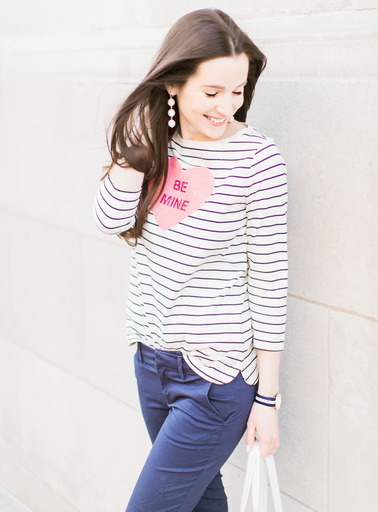 How to enjoy Valentine's Day as a single gal by fashion blogger Stephanie Ziajka from Diary of a Debutante, what to do on Valentine's Day when you are single, how to spend Valentine's Day alone | Talbots striped Be Mine heart tee with navy Lilly Pulitzer capri pants, Vera Bradley white peony Mallory Tote, Sugarfix by Baublebar white triad ball drop earrings, navy striped Daniel Wellington watch, and Sam Edelman nude patent leather pumps