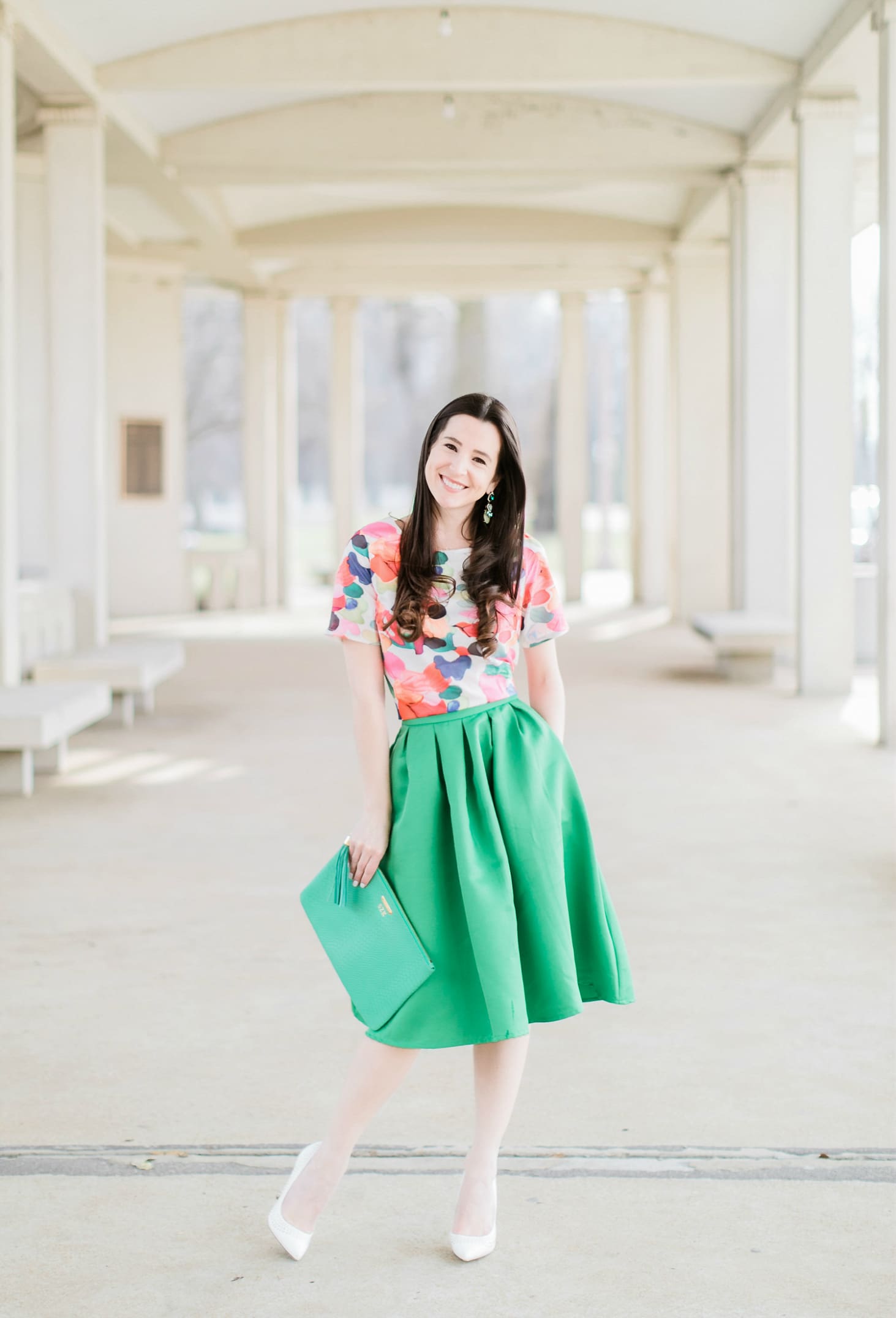 Why We Should Embrace Modesty in Modern Fashion by southern fashion blogger Stephanie Ziajka from Diary of a Debutante, kelly green a-line skirt styled with a colorful calico print crop top, white pointed toe pumps, and a green monogrammed GiGi New York Uber clutch, modest outfit for women, modest dresses and skirts for women