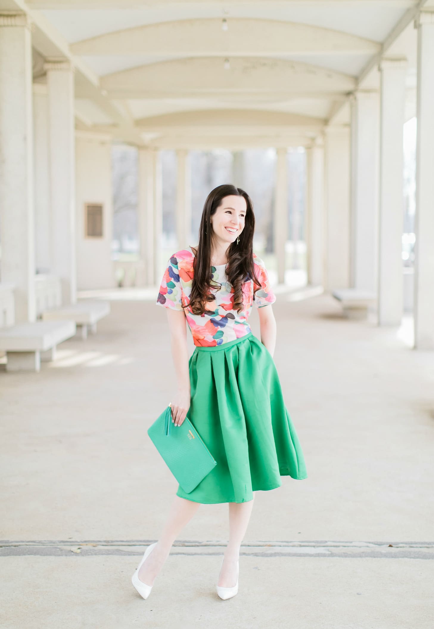 Why We Should Embrace Modesty in Modern Fashion by southern fashion blogger Stephanie Ziajka from Diary of a Debutante, kelly green a-line skirt styled with a colorful calico print crop top, white pointed toe pumps, and a green monogrammed GiGi New York Uber clutch, modest outfit for women, modest dresses and skirts for women