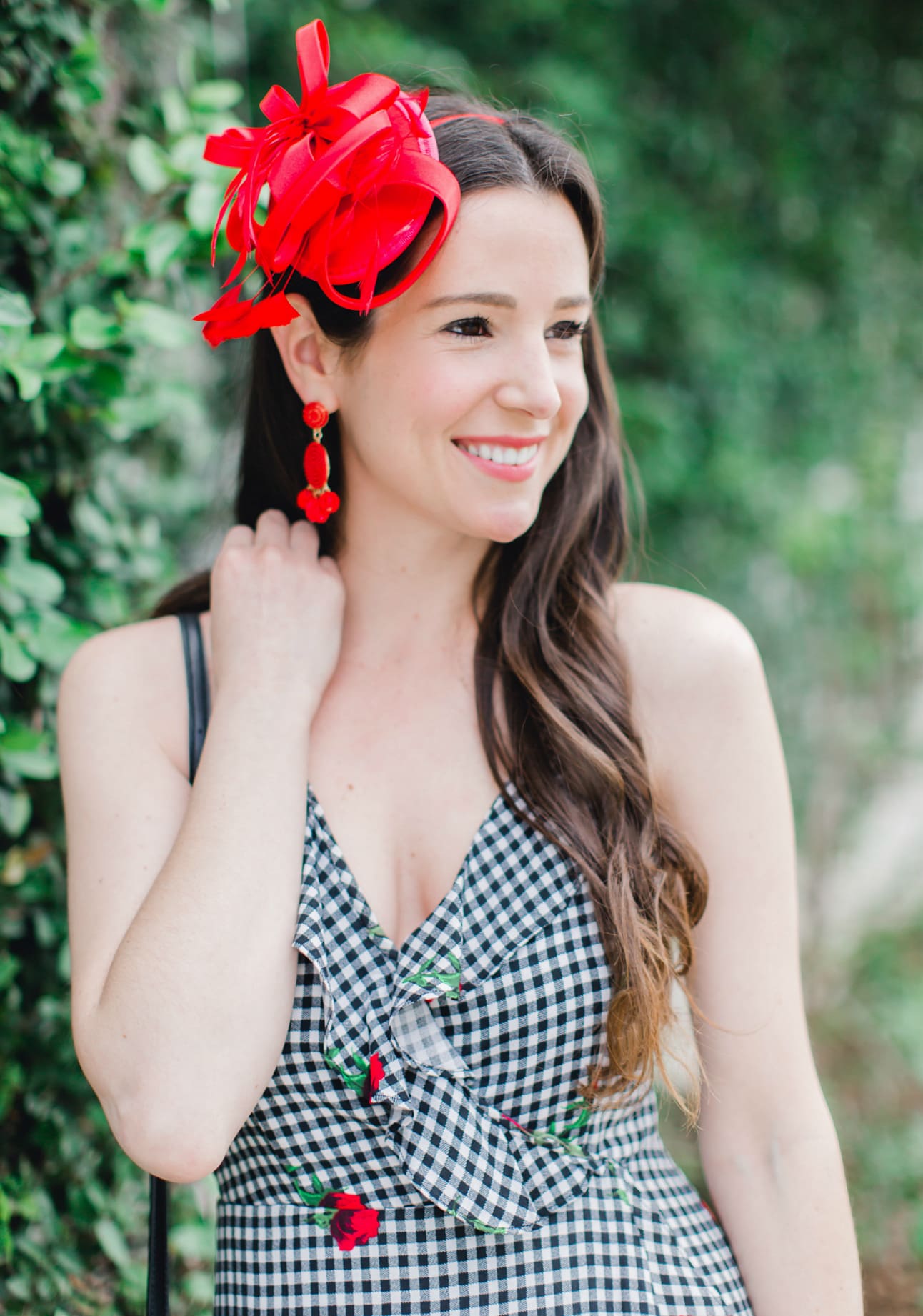 What to Wear on Derby Day: 5 Derby-Approved Outfit Ideas by southern fashion blogger Stephanie Ziajka from Diary of a Debutante, derby day fashion rules, derby day fascinators online, how to wear derby day fascinator, derby day dress code, black and white Kentucky Derby dress with affordable red fascinator, red open toe sandals, red drop bead tassel earrings, and black crossbody bag