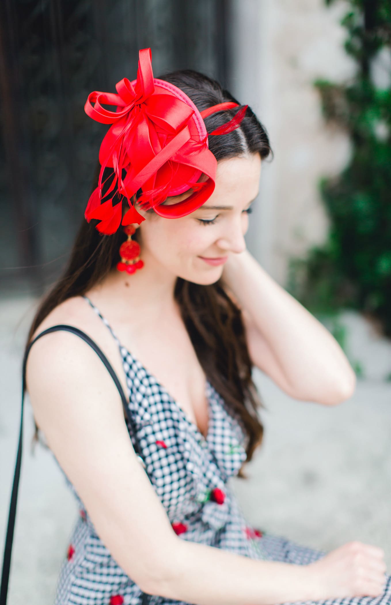 What to Wear on Derby Day: 5 Derby-Approved Outfit Ideas by southern fashion blogger Stephanie Ziajka from Diary of a Debutante, derby day fashion rules, derby day fascinators online, how to wear derby day fascinator, derby day dress code, black and white Kentucky Derby dress with affordable red fascinator, red open toe sandals, red drop bead tassel earrings, and black crossbody bag