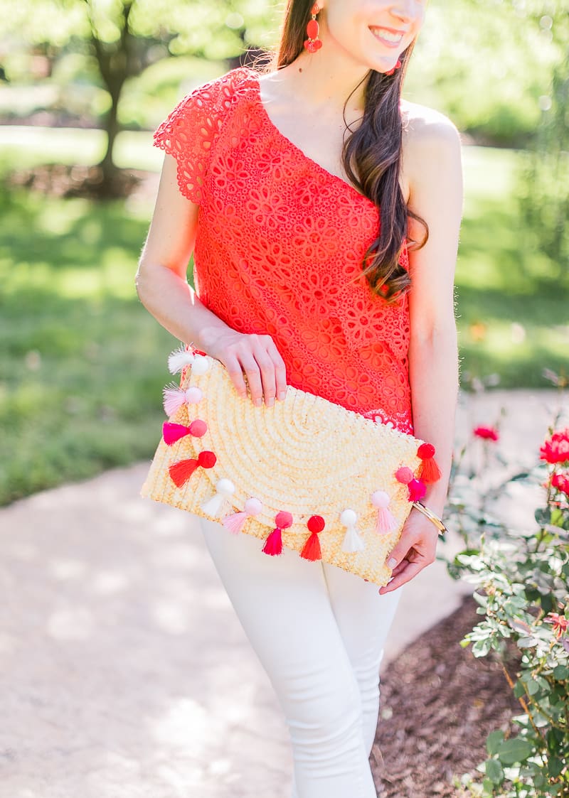 What to wear over Memorial Day Weekend by southern fashion blogger Stephanie Ziajka from Diary of a Debutante, Memorial Day outfit idea, BB Dakota Lolita top styled with white Levi's ankle skinny jeans, Madden nude wedges, Amazon straw tassel clutch, Amazon red beaded earrings, and Kendra Scott Aubrey mixed metals bangle bracelet set
