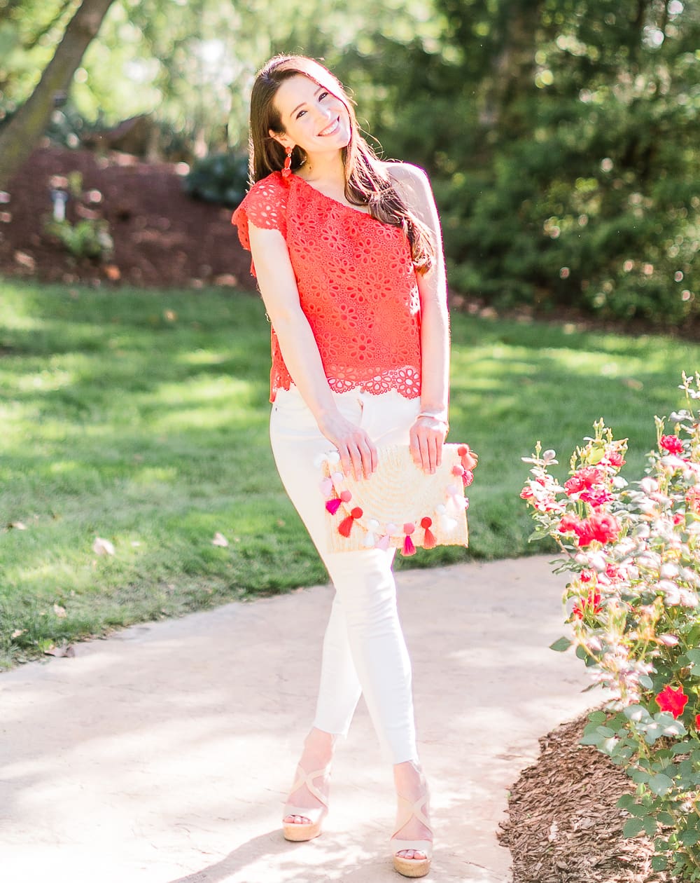 What to wear over Memorial Day Weekend by southern fashion blogger Stephanie Ziajka from Diary of a Debutante, Memorial Day outfit idea, BB Dakota Lolita top styled with white Levi's ankle skinny jeans, Madden nude wedges, Amazon straw tassel clutch, Amazon red beaded earrings, and Kendra Scott Aubrey mixed metals bangle bracelet set