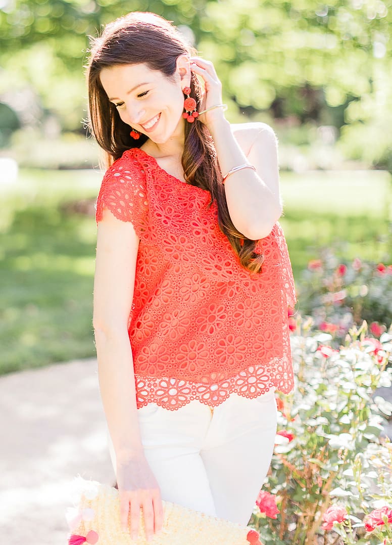 What to wear over Memorial Day Weekend by southern fashion blogger Stephanie Ziajka from Diary of a Debutante, Memorial Day outfit idea, BB Dakota Lolita top styled with white Levi's ankle skinny jeans, Madden nude wedges, Amazon straw tassel clutch, Amazon red beaded earrings, and Kendra Scott Aubrey mixed metals bangle bracelet set