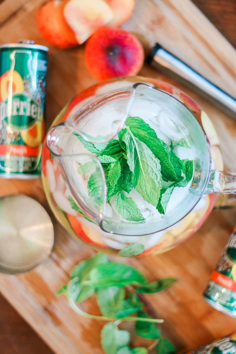 Skinny peach mint cocktail made with Peach Perrier and organic blue agave by southern blogger Stephanie Ziajka from Diary of a Debutante, skinny peach mojito recipe, summer cocktail with flavored carbonated water, Perrier flavors