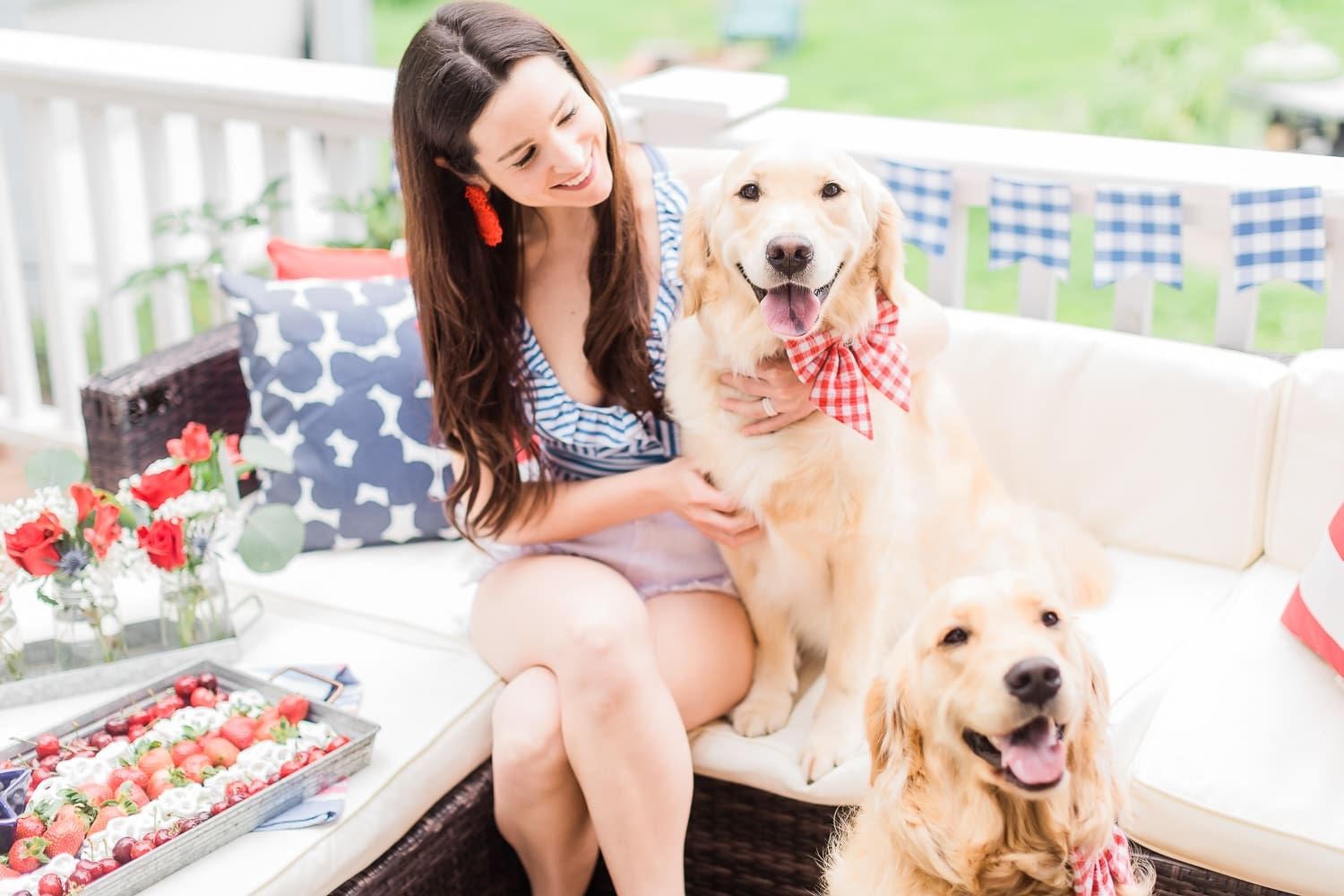 Golden retriever puppies dressed up in red gingham collars and bows for the 4th of July on Diary of a Debutante