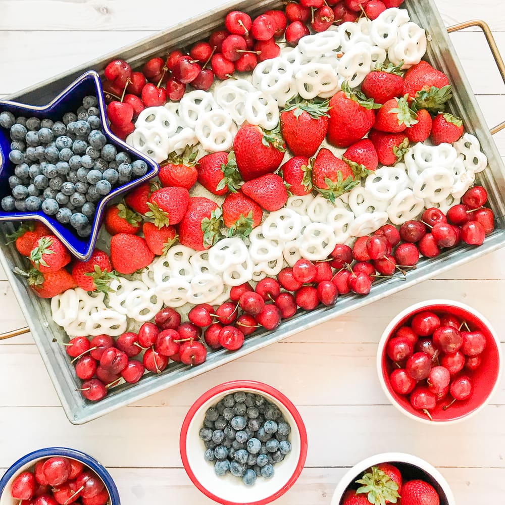 Healthy 4th of July snack tray created with berries and yogurt-covered pretzels by blogger Stephanie Ziajka on Diary of a Debutante