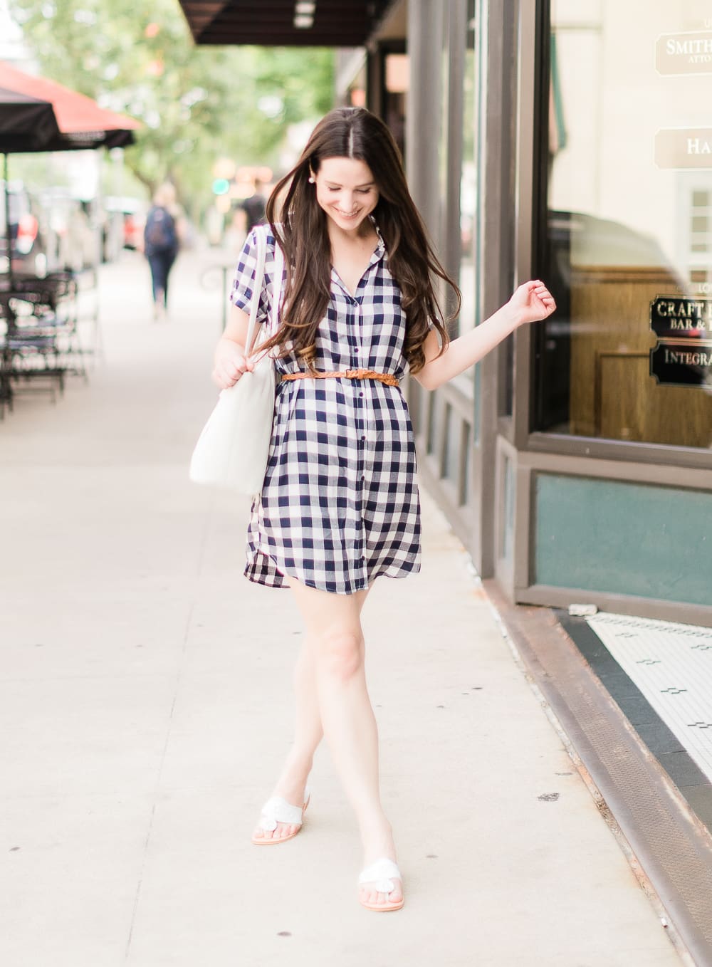 How to wear a plaid shirtdress in the summer by southern fashion blogger Stephanie Ziajka from Diary of a Debutante, how to wear plaid shirtdress, plaid shirt dress outfit, style plaid, BB Dakota Cicely Shirtdress styled with white Jack Rogers sandals, a white Vera Bradley Mallory tote, skinny braided leather belt, and large pearl stud earrings