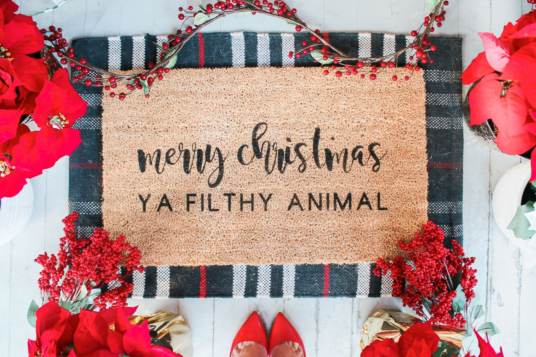 "Merry Christmas Ya Filthy Animal" DIY Painted Doormat by southern lifestyle blogger Stephanie Ziajka from Diary of a Debutante, DIY doormat stencil with Cricut Explore Air 2, Cricut doormat tutorial, DIY outdoor mat, paint your own doormat tutorial, paint doormat