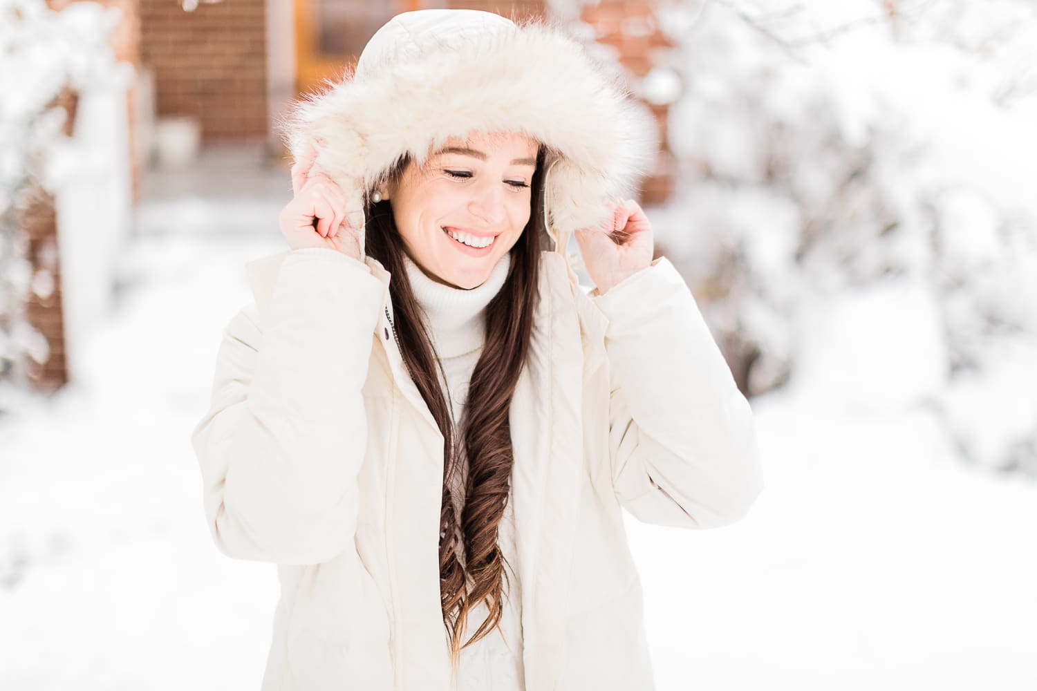 How to Style Bean Boots with the LLBean Ultrawarm Coat by affordable fashion and southern lifestyle blogger Stephanie Ziajka from Diary of a Debutante, LLBean Ultrawarm Coat Three Quarter Length in paperwhite, bean boots style, parka outfit ideas, white sweater outfit, LLBean bean boots styled with LLBean ultrawarm coat, white skinny jeans, and a white oversized turtleneck sweater