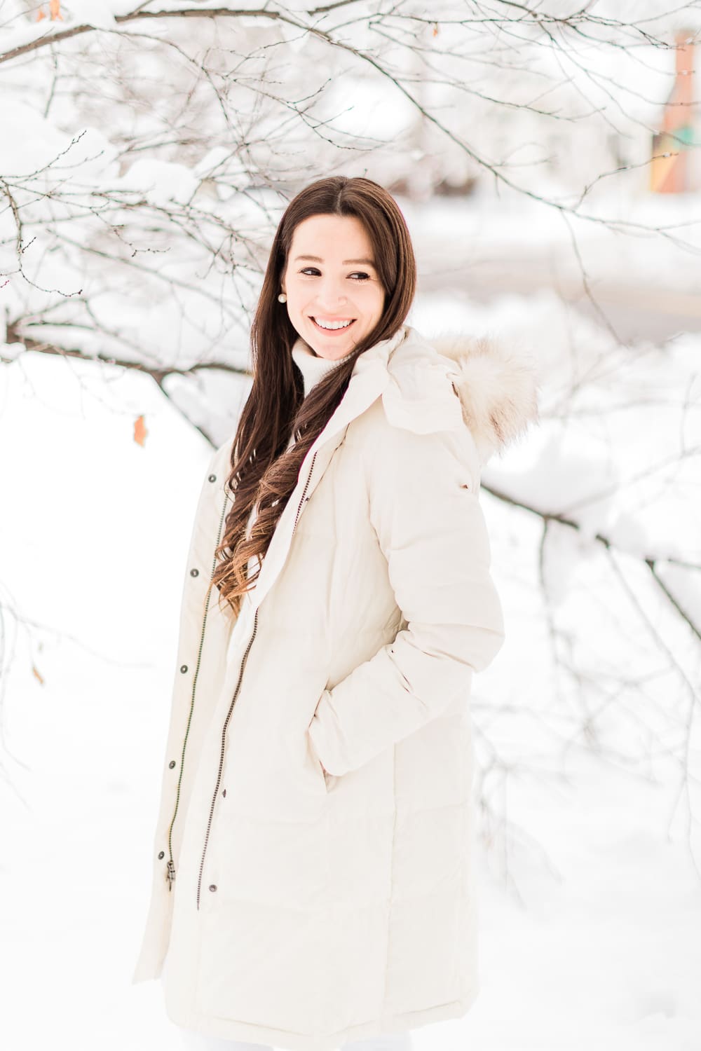 How to Style Bean Boots with the LLBean Ultrawarm Coat by affordable fashion and southern lifestyle blogger Stephanie Ziajka from Diary of a Debutante, LLBean Ultrawarm Coat Three Quarter Length in paperwhite, bean boots style, parka outfit ideas, white sweater outfit, LLBean bean boots styled with LLBean ultrawarm coat, white skinny jeans, and a white oversized turtleneck sweater