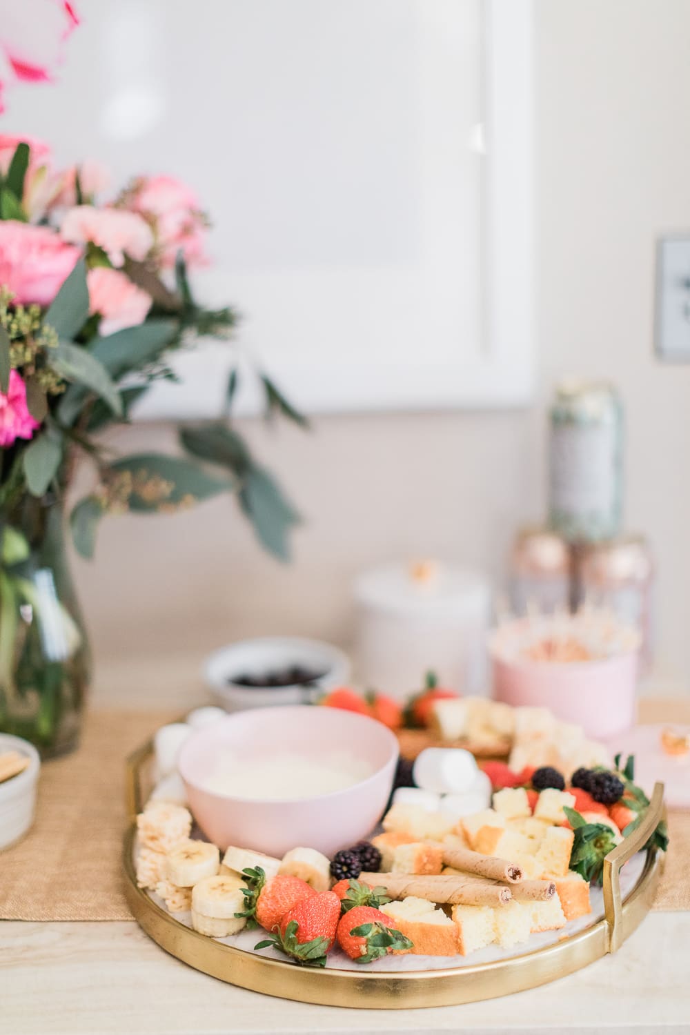 tips for hosting a fondue party, how to make a chocolate fondue bar, chocolate fondue bar tips, DIY dessert board ideas, easy Galentine's Day dessert board, dessert fondue dippers, how to throw a fondue party, Simple skincare review, Simple Micellar Cleansing Water review, Simple Cleansing Facial Wipes review, Galentine's Day gift box ideas