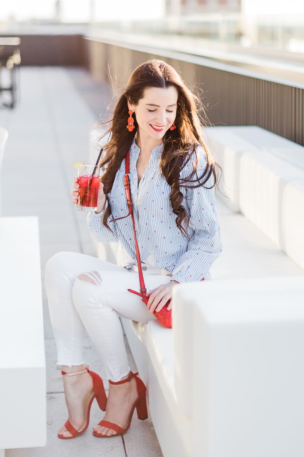 Currently Wearing: Blue Stripes and Red Fashion Accessories by Stephanie Ziajka from the affordable fashion and southern lifestyle blog Diary of a Debutante, Old Navy blue stripe button front top styled with white skinny jeans, and red accessories like red block heel sandals and a red Vera Bradley Carryall Small Crossbody bag, red dress accessories, red fashion jewelry