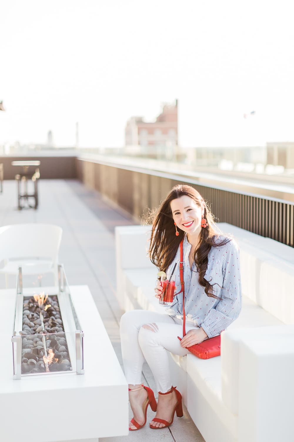 Currently Wearing: Blue Stripes and Red Fashion Accessories by Stephanie Ziajka from the affordable fashion and southern lifestyle blog Diary of a Debutante, Old Navy blue stripe button front top styled with white skinny jeans, and red accessories like red block heel sandals and a red Vera Bradley Carryall Small Crossbody bag, red dress accessories, red fashion jewelry