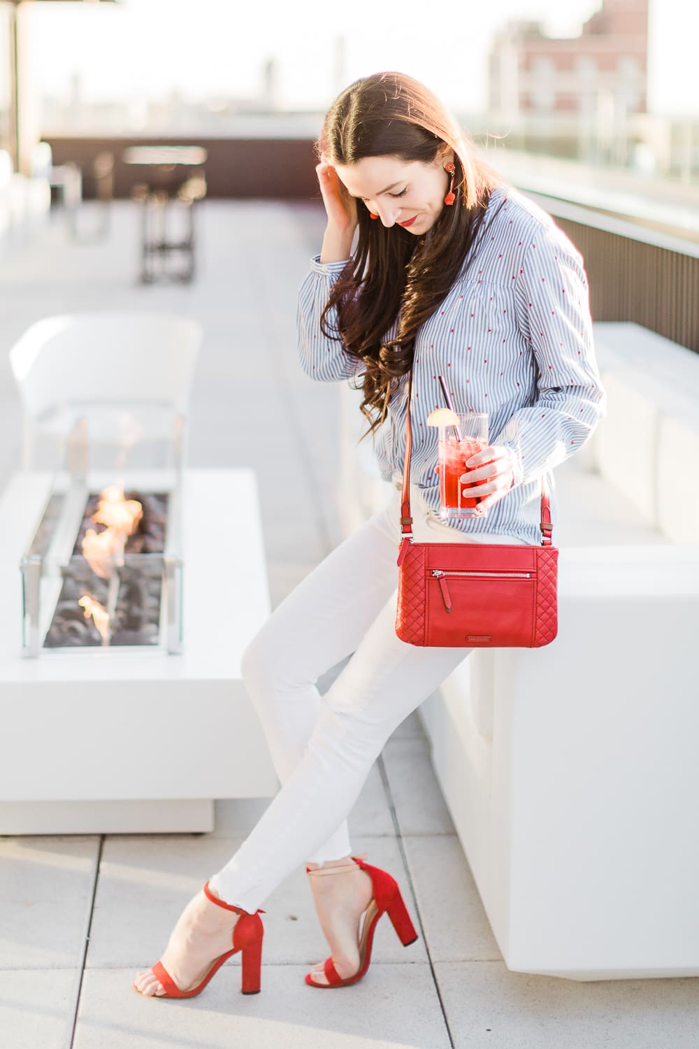 Currently Wearing: Blue Stripes and Red Fashion Accessories by Stephanie Ziajka from the affordable fashion and southern lifestyle blog Diary of a Debutante, Old Navy blue stripe button front top styled with white skinny jeans, and red accessories like red block heel sandals and a red Vera Bradley Carryall Small Crossbody bag, red dress accessories, red fashion jewelry