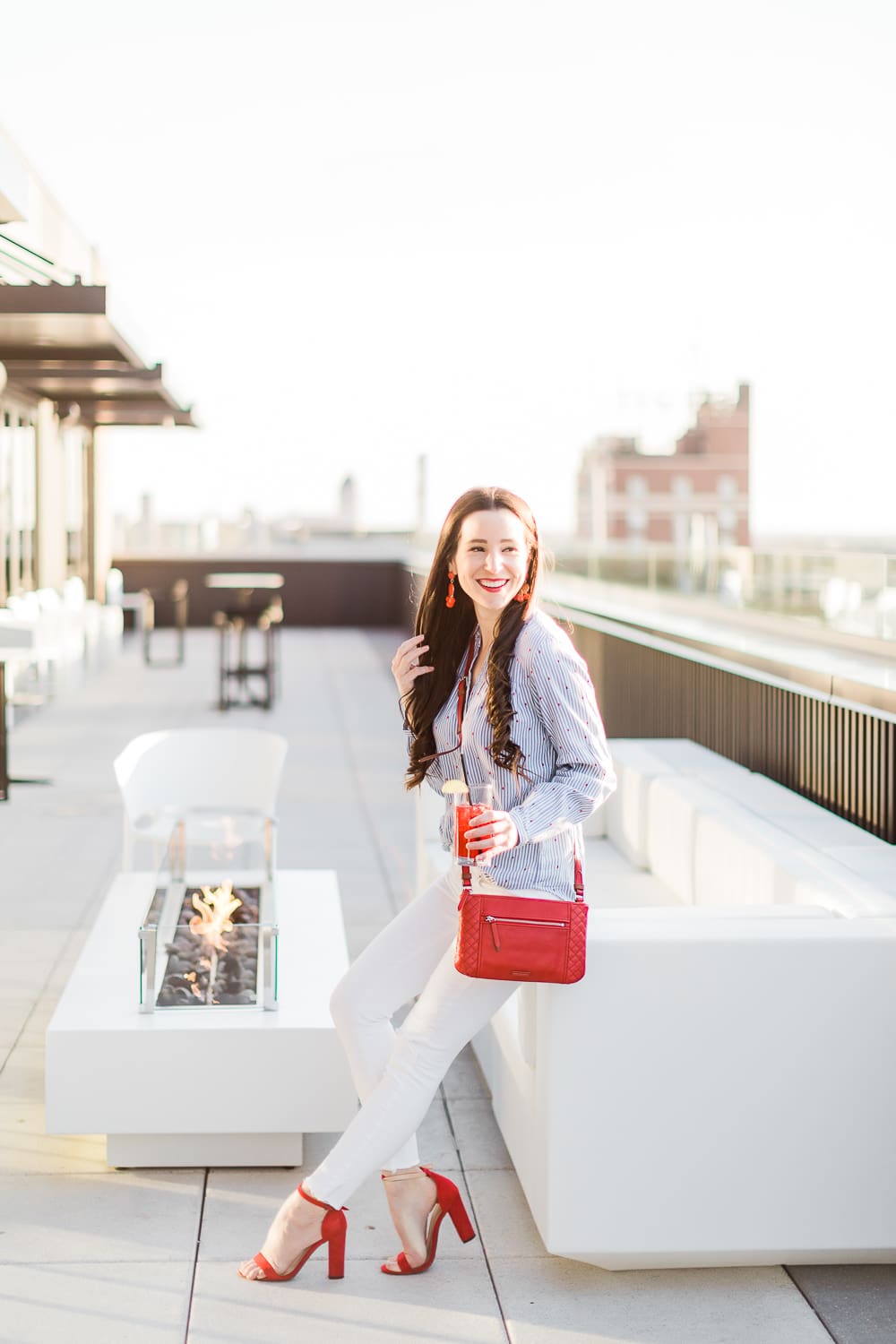Currently Wearing: Blue Stripes and Red Fashion Accessories by Stephanie Ziajka from the affordable fashion and southern lifestyle blog Diary of a Debutante, Old Navy blue stripe button front top styled with white skinny jeans, and red accessories like red block heel sandals and a red Vera Bradley Carryall Small Crossbody bag, red dress accessories, red fashion jewelry