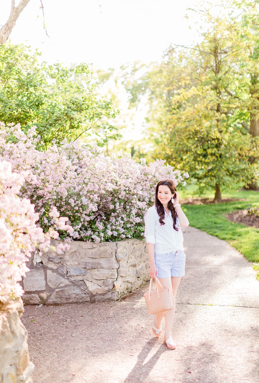 Old Navy Twill Everday Shorts: Long Sleeve Dress Shirt with Shorts Outfit by Stephanie Ziajka from the popular affordable fashion blog Diary of a Debutante, how to wear striped shorts, striped Old Navy Twill Everyday Shorts, how to wear twill shorts, J.Crew Factory White Oxford Shirt, Target Basket Crossbody Bag, White Kendra Scott Danielle Earrings, White Michele Watch, White Jack Rogers Sandals