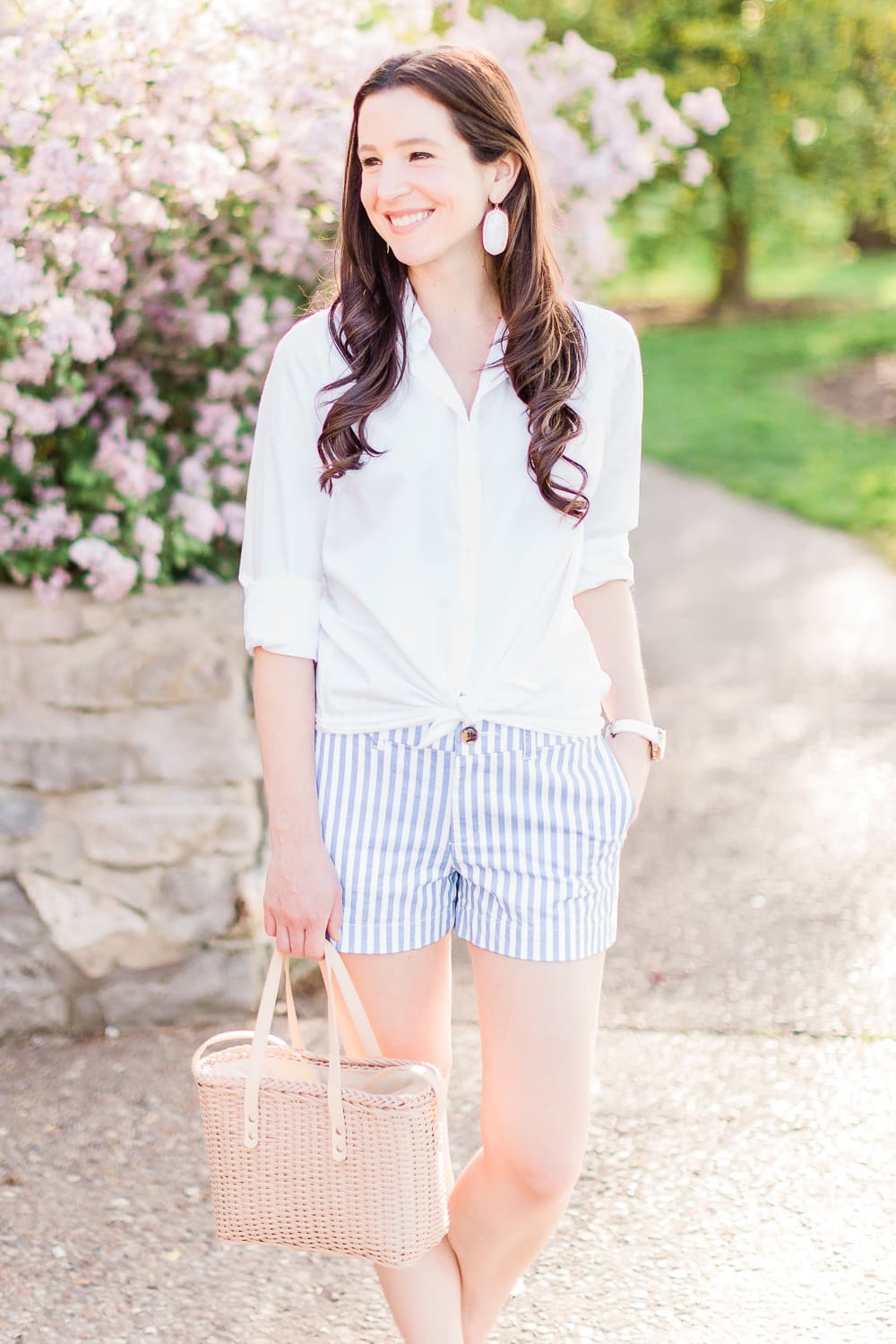 Old Navy Twill Everday Shorts: Long Sleeve Dress Shirt with Shorts Outfit by Stephanie Ziajka from the popular affordable fashion blog Diary of a Debutante, how to wear striped shorts, striped Old Navy Twill Everyday Shorts, how to wear twill shorts, J.Crew Factory White Oxford Shirt, Target Basket Crossbody Bag, White Kendra Scott Danielle Earrings, White Michele Watch, White Jack Rogers Sandals