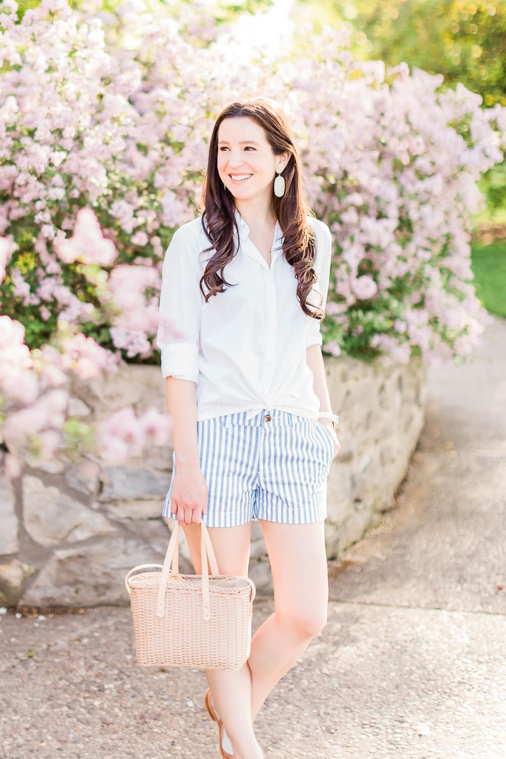 Old Navy Twill Everday Shorts: Long Sleeve Dress Shirt with Shorts Outfit by Stephanie Ziajka from the popular affordable fashion blog Diary of a Debutante, how to wear striped shorts, striped Old Navy Twill Everyday Shorts, how to wear twill shorts, J.Crew Factory White Oxford Shirt, Target Basket Crossbody Bag, White Kendra Scott Danielle Earrings, White Michele Watch, White Jack Rogers Sandals