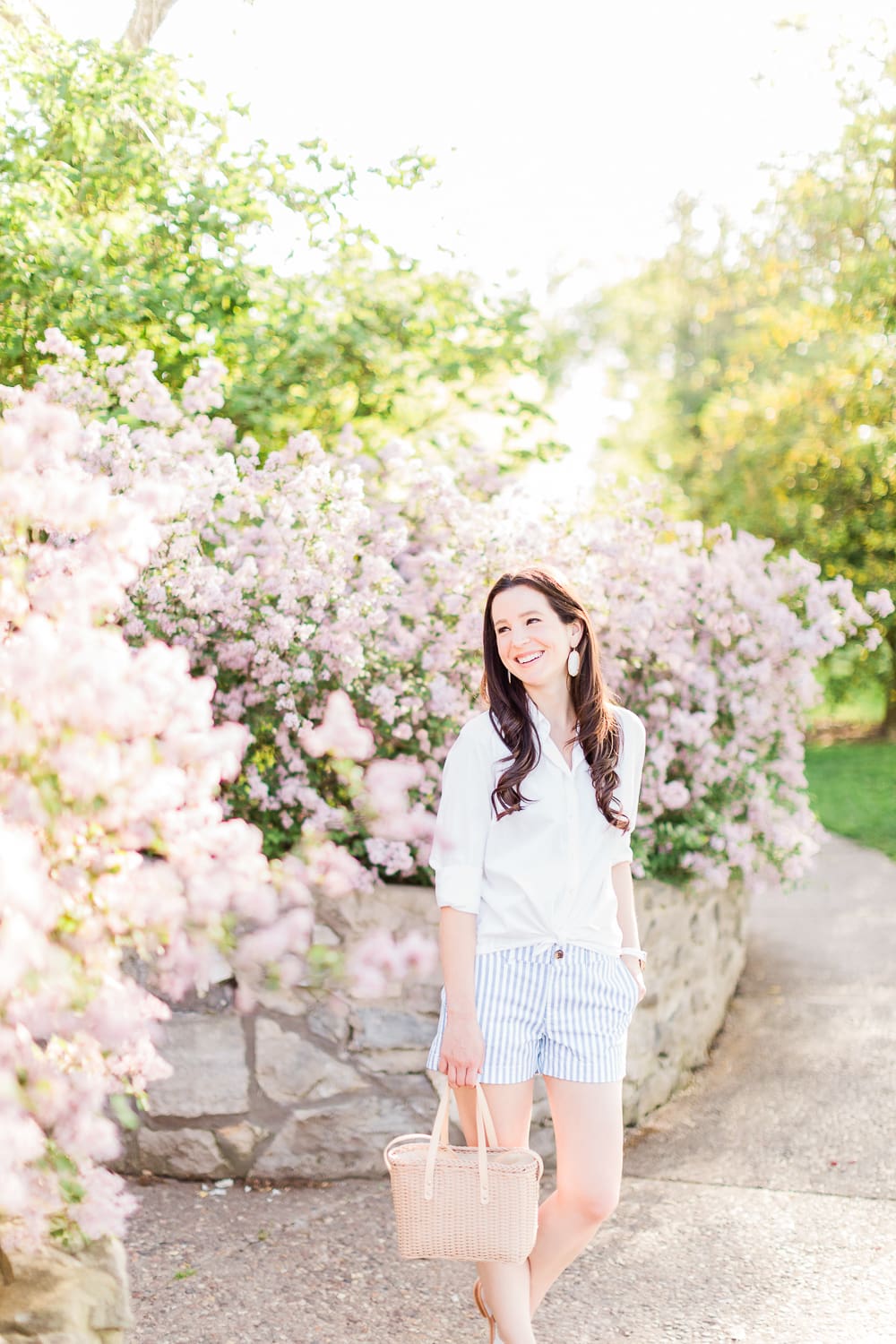 Old Navy Twill Everday Shorts: Long Sleeve Dress Shirt with Shorts Outfit by Stephanie Ziajka from the popular affordable fashion blog Diary of a Debutante, how to wear striped shorts, striped Old Navy Twill Everyday Shorts, how to wear twill shorts, J.Crew Factory White Oxford Shirt, Target Basket Crossbody Bag, White Kendra Scott Danielle Earrings, White Michele Watch, White Jack Rogers Sandals