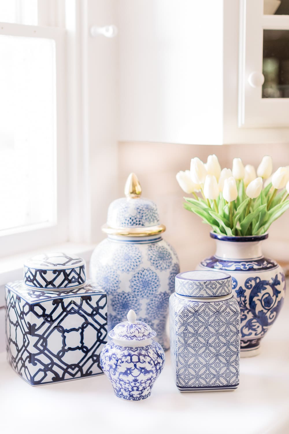 Amazon Home Decor Finds: Blue and White Ginger Jars under $100 by popular southern lifestyle blogger Stephanie Ziajka on Diary of a Debutante, blue and white ceramic vase, blue and white ceramics, blue and white porcelain ginger jars, large ginger jars, small ginger jars, how to decorate with ginger jars, ginger jar vase with white tulips