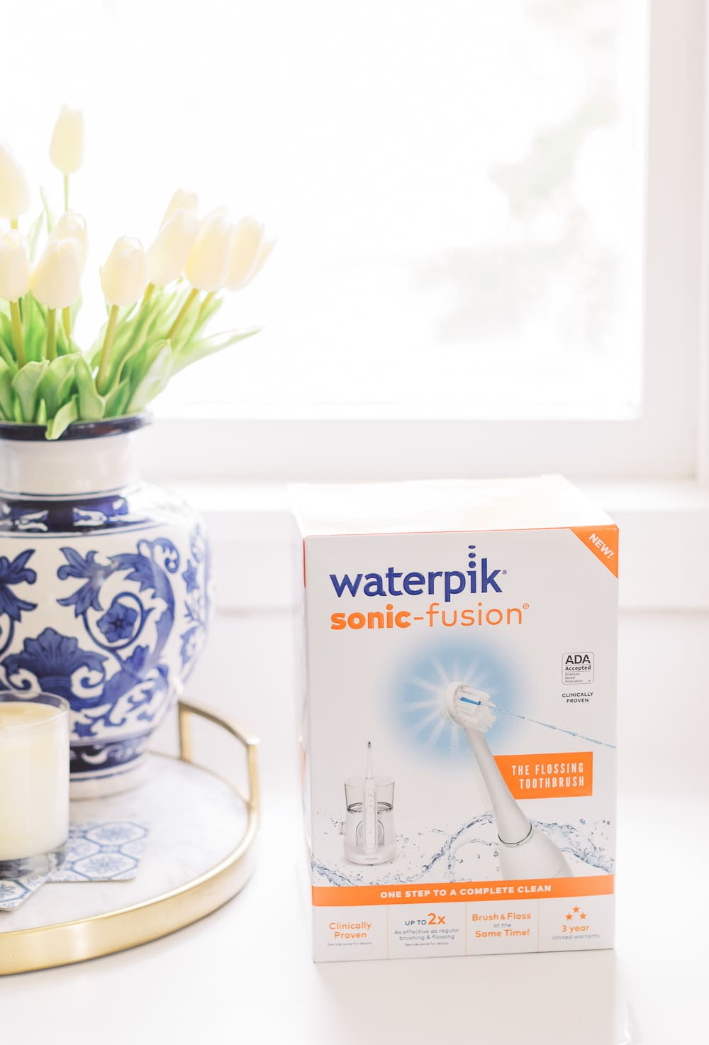 Waterpik Sonic Fusion Flossing Toothbrush, Sonic-Fushion Flossing Toothbrush Review by popular southern lifestyle blogger Stephanie Ziajka from Diary of a Debutante, morning self-care routine, drinking coffee on the couch, pink silk pajama set