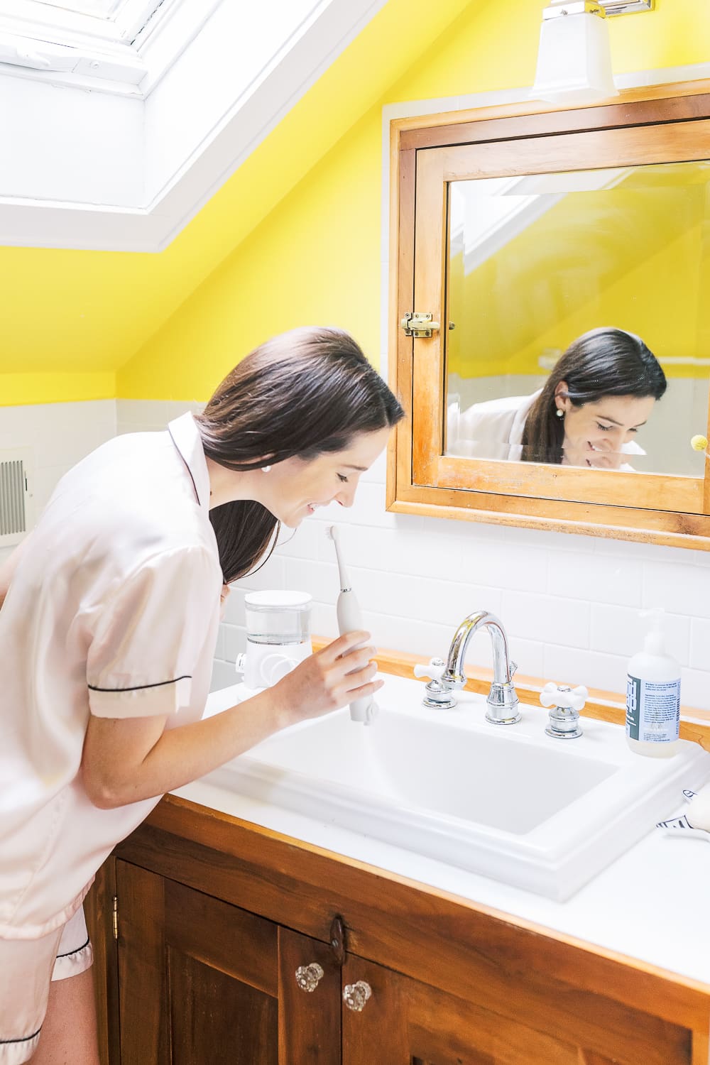 Waterpik Sonic Fusion Flossing Toothbrush, Sonic-Fushion Flossing Toothbrush Review by popular southern lifestyle blogger Stephanie Ziajka from Diary of a Debutante, morning self-care routine, drinking coffee on the couch, pink silk pajama set